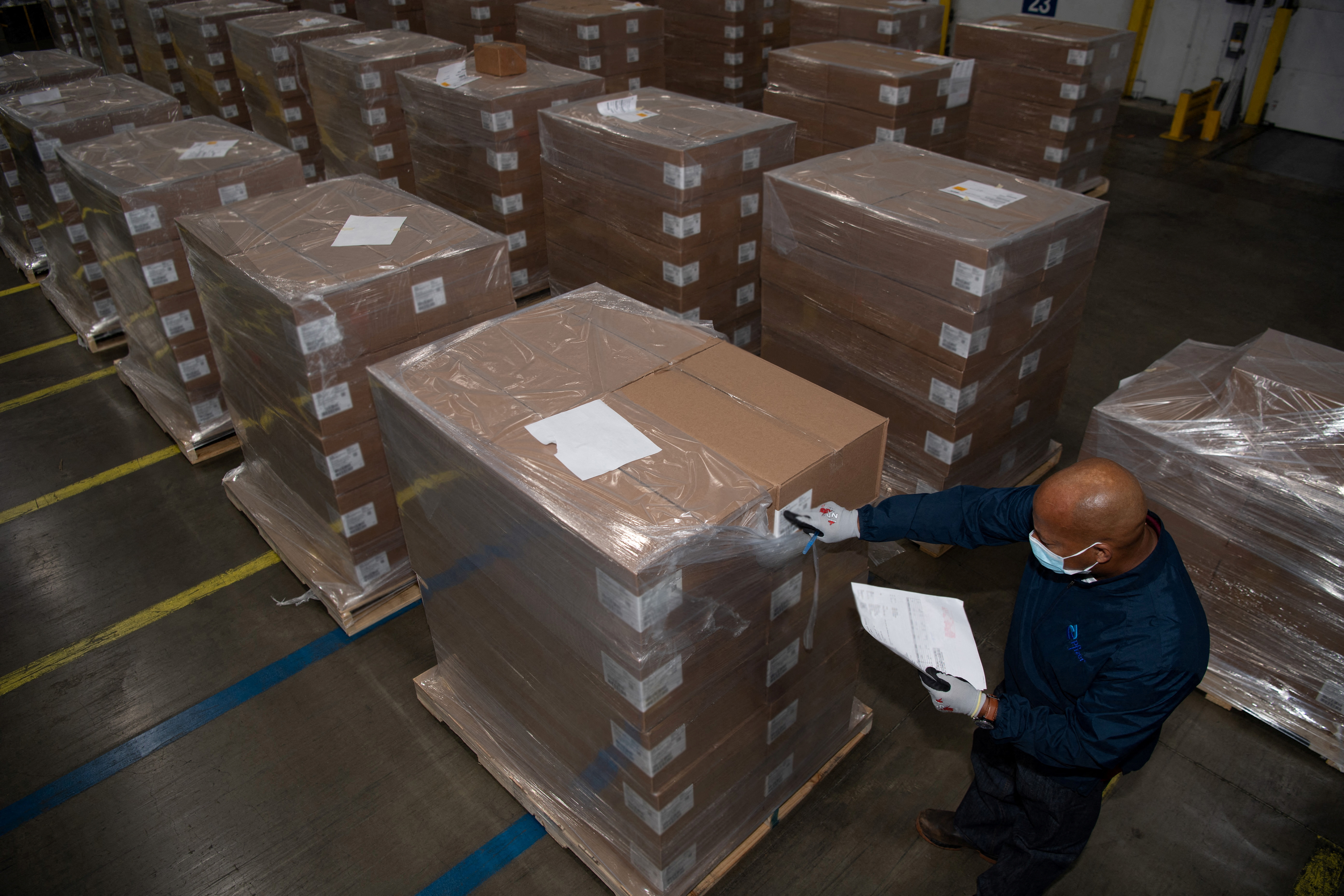 A Pfizer employee checks the boxes containing Paxlovid, COVID-19 treatment pills, at a distribution facility in Memphis, Tennessee, U.S. in this undated handout picture. Pfizer/Handout via REUTERS    