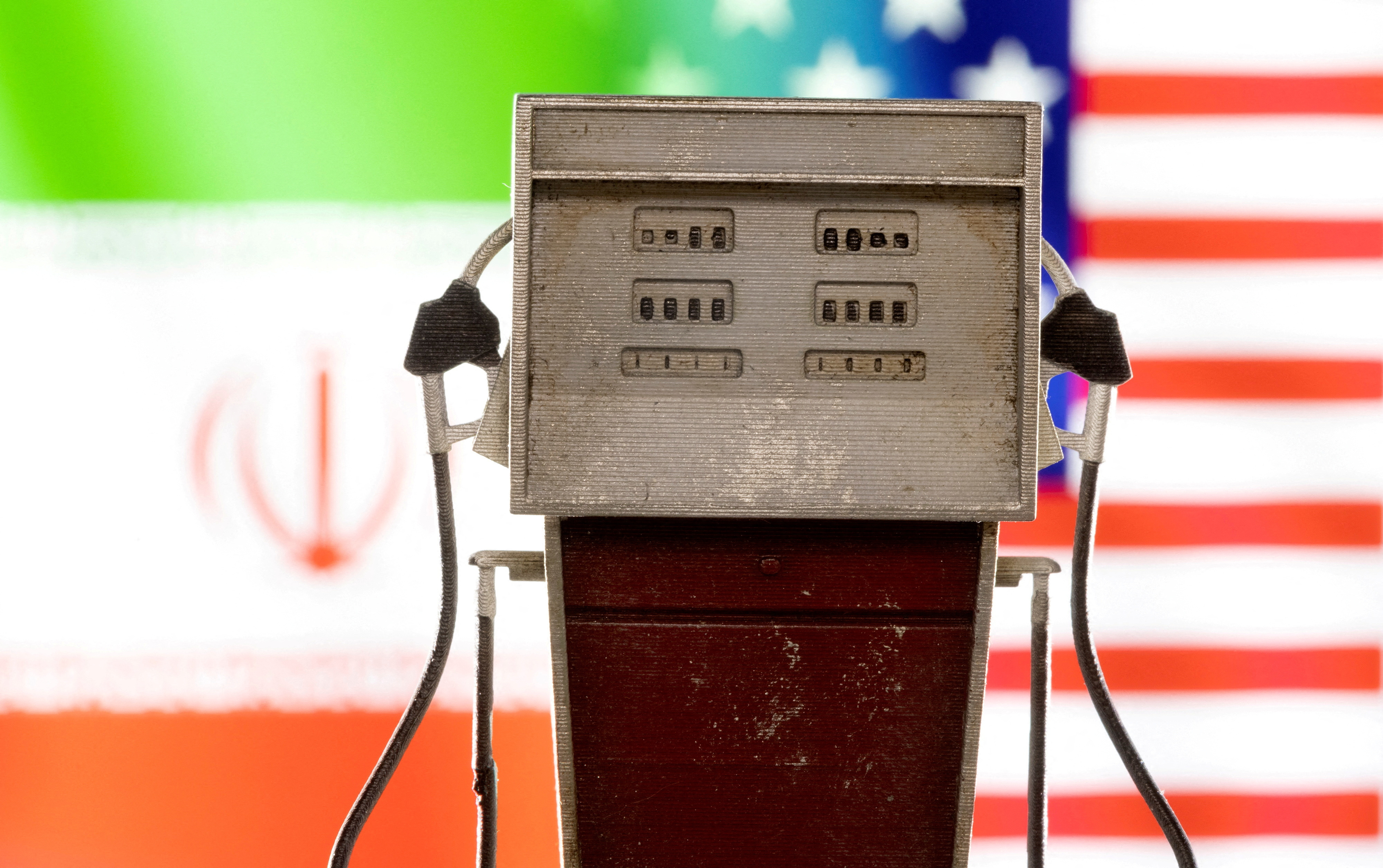 Illustration shows model of petrol pump, U.S. and Iran flag colors