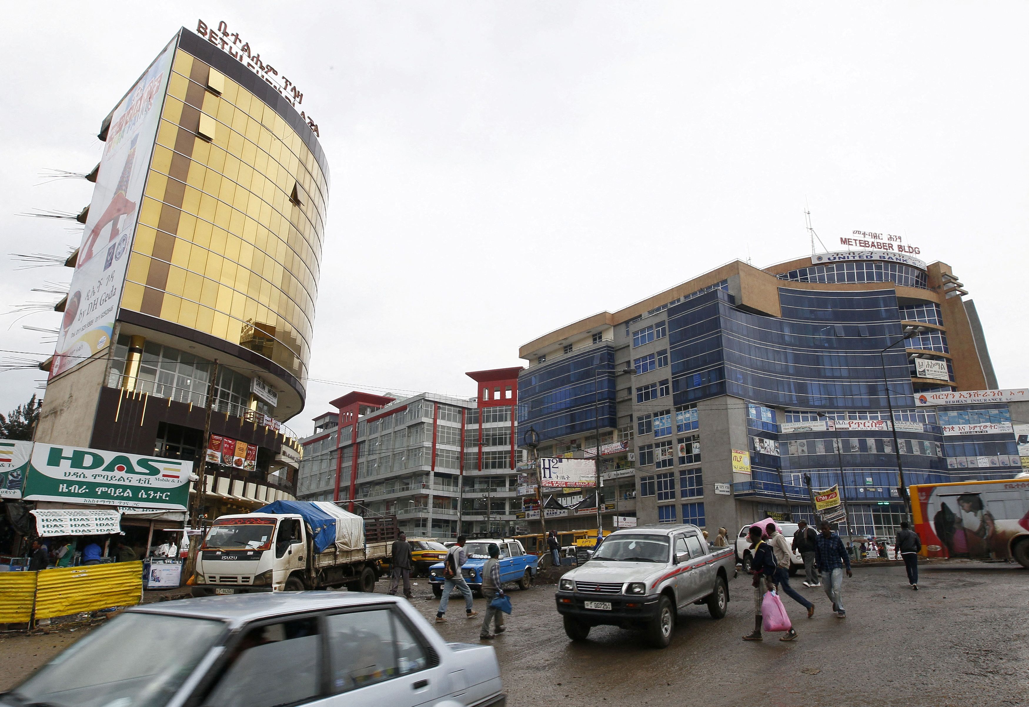 People walk through the streets of a shopping area in Addis Ababa