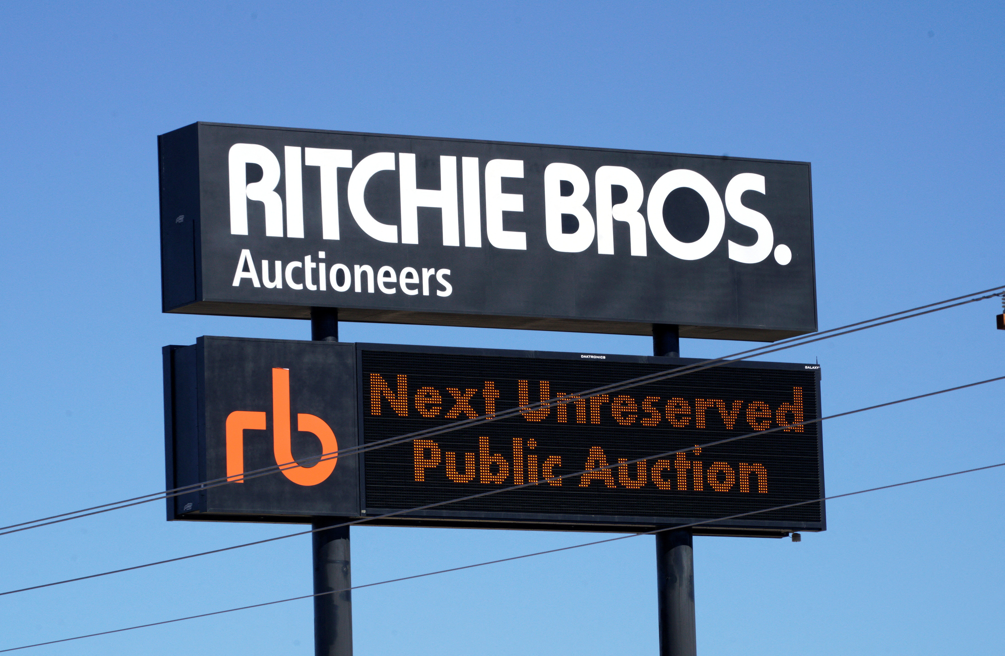 The sign outside Richie Bros. Auctioneers is seen in Longmont