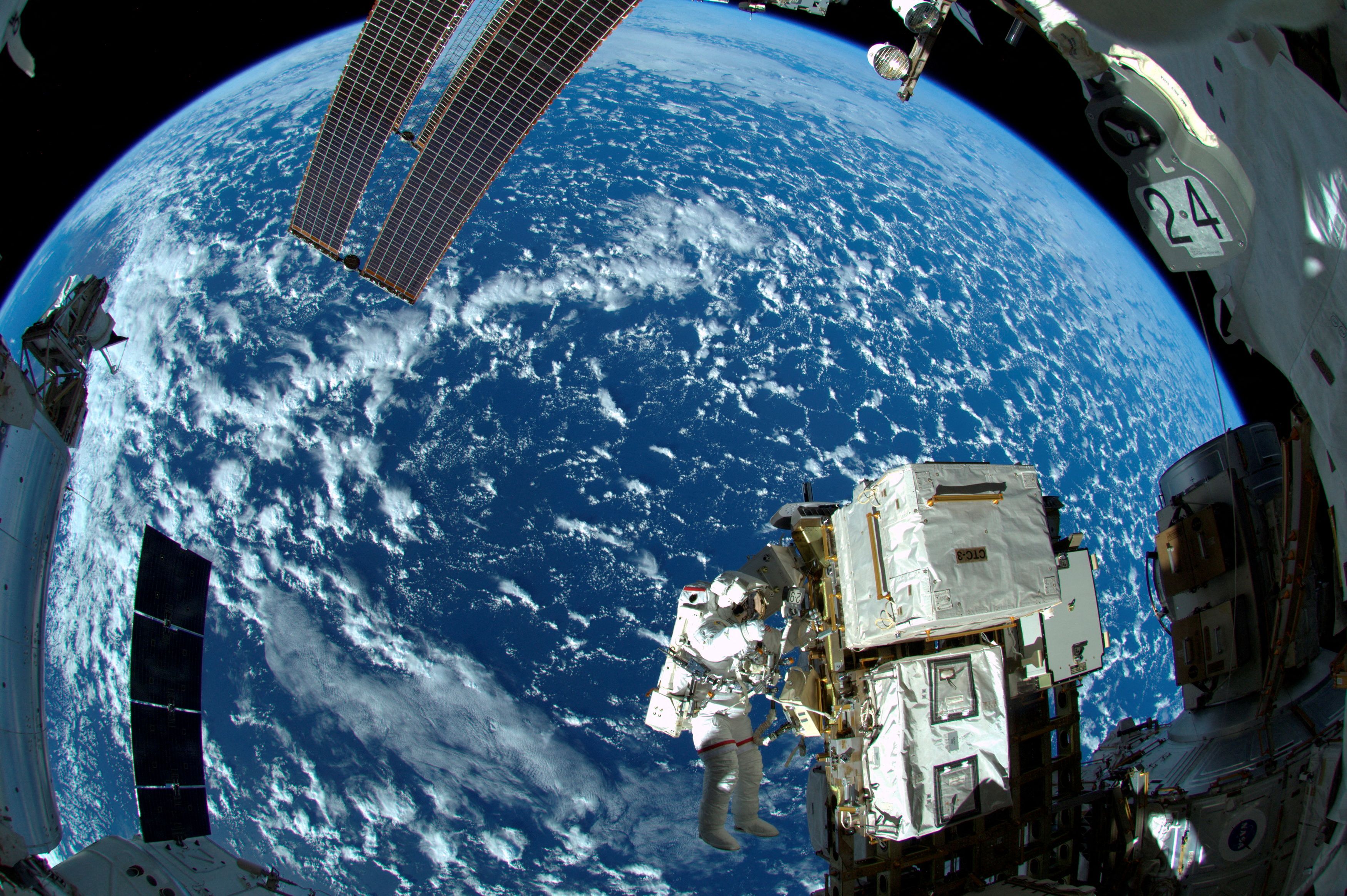 NASA astronaut Reid Wiseman works outside the International Space Station