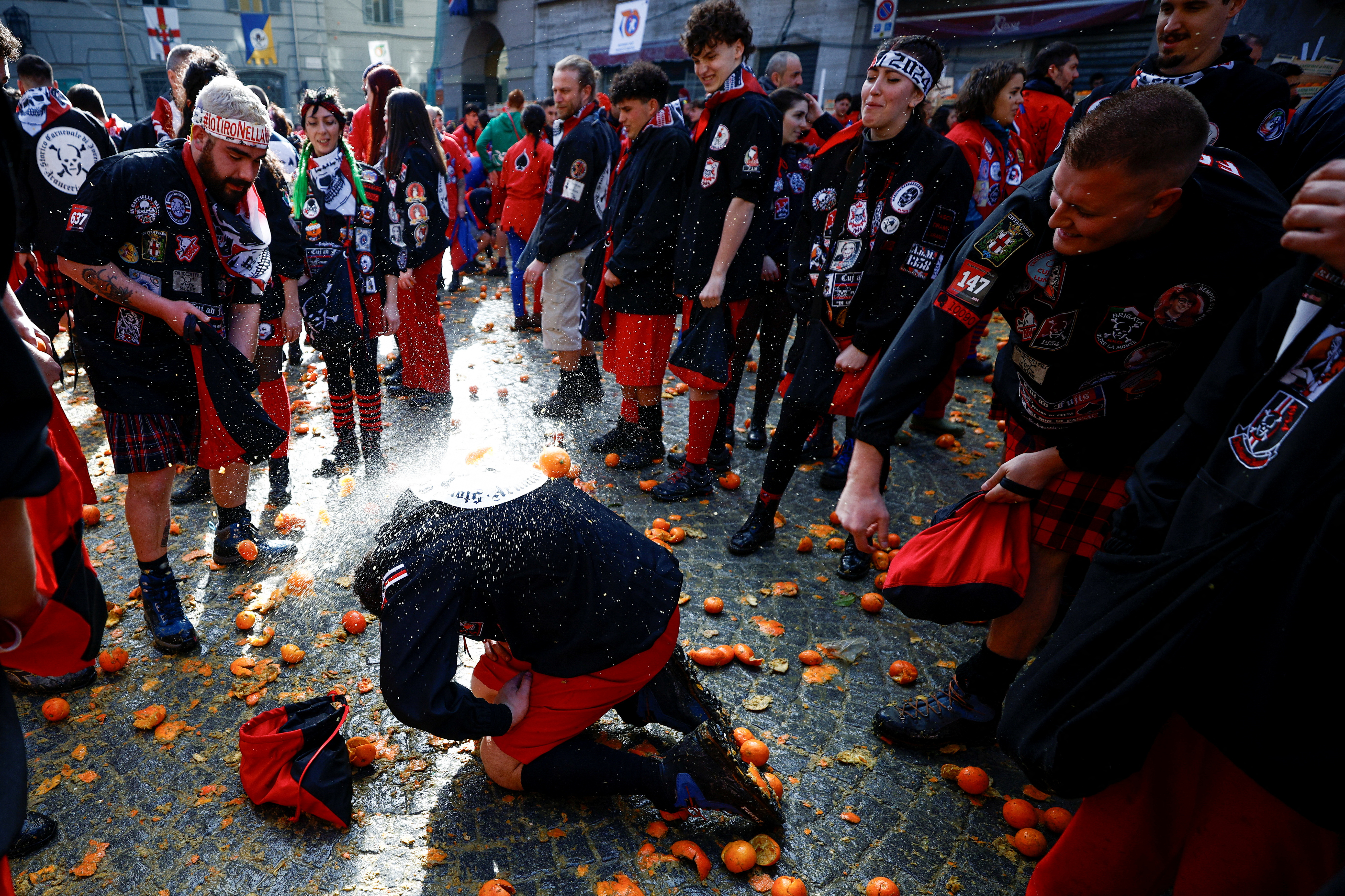 Rival teams battle with oranges to celebrate an annual carnival battle in Ivrea