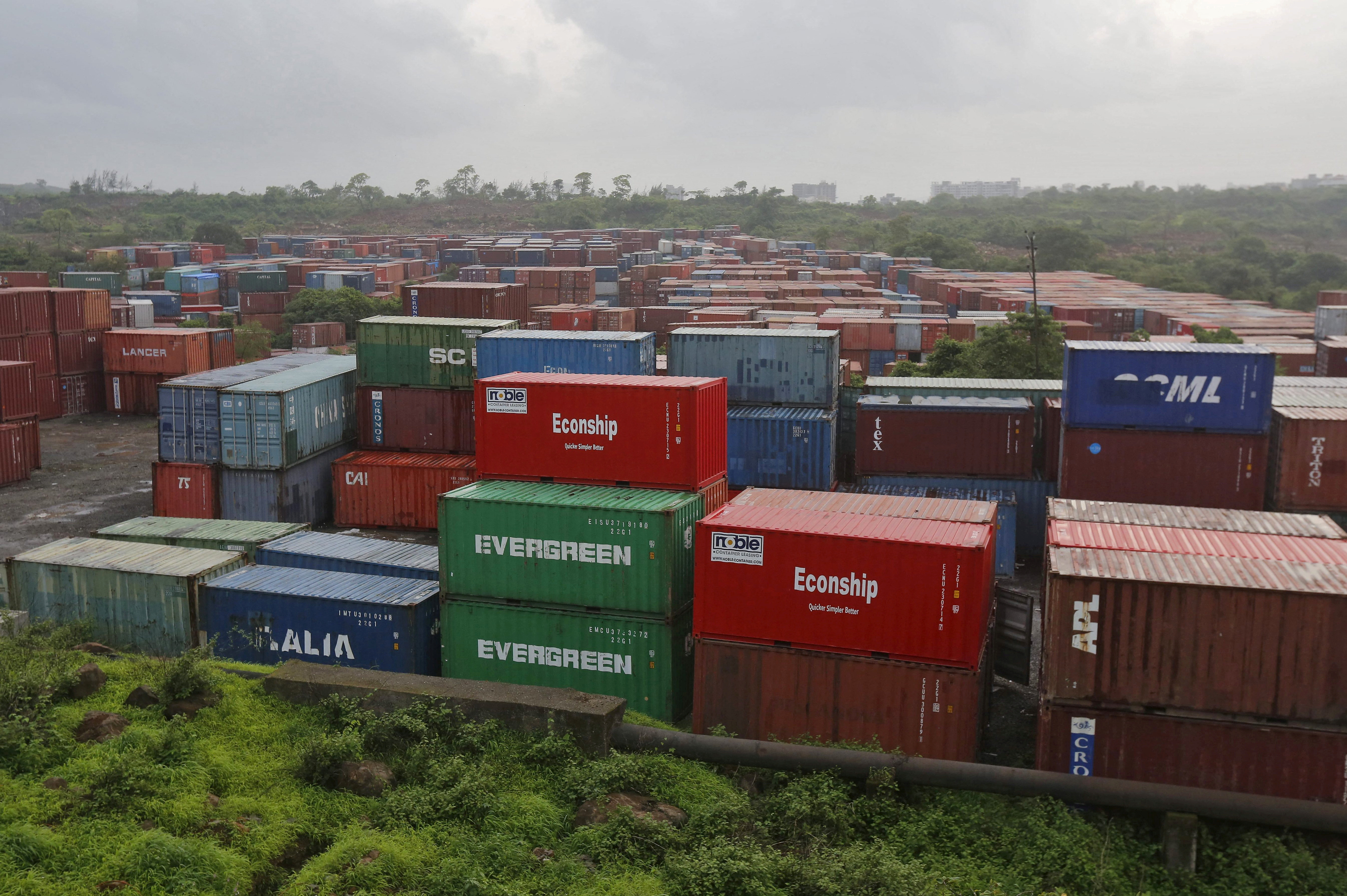 Cargo containers are seen stacked outside the container terminal of JNPT in Mumbai