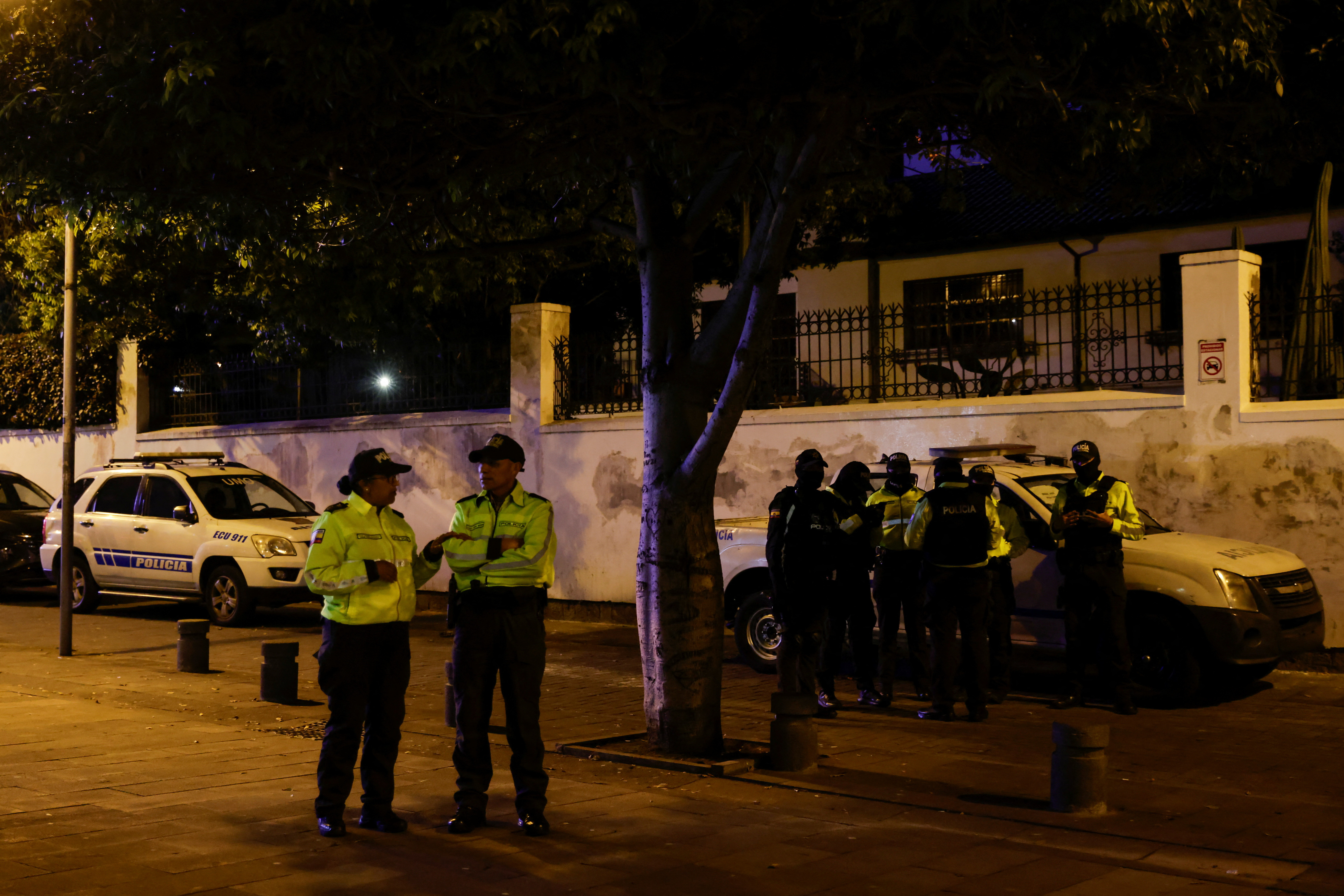 Ecuadorean police officers stand outside the Mexican embassy where they forcibly removed the former Ecuador Vice President Jorge Glas in Quito