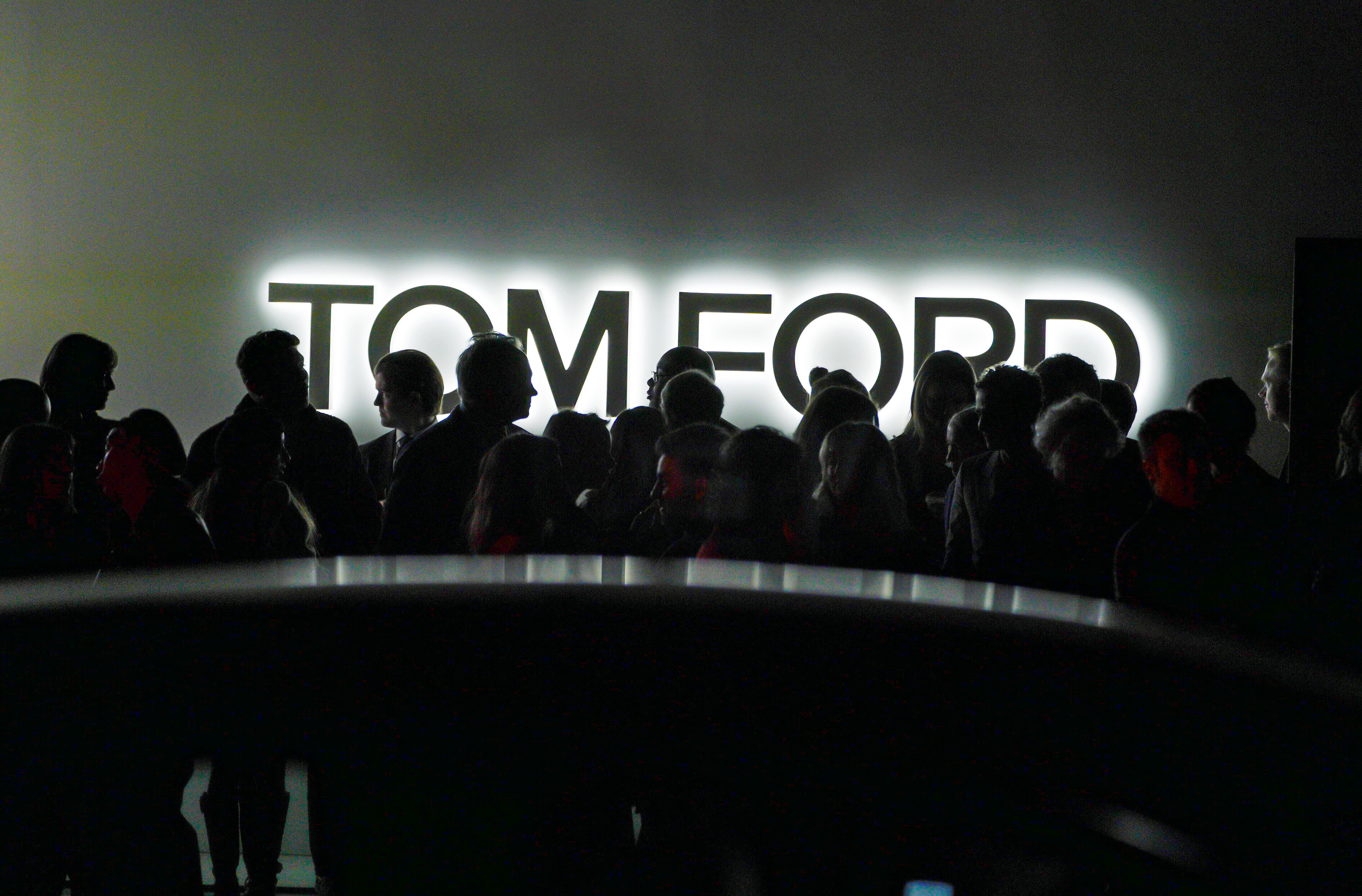 Attendees wait for transportation outside the Tom Ford AW20 Show at Milk Studios in Los Angeles