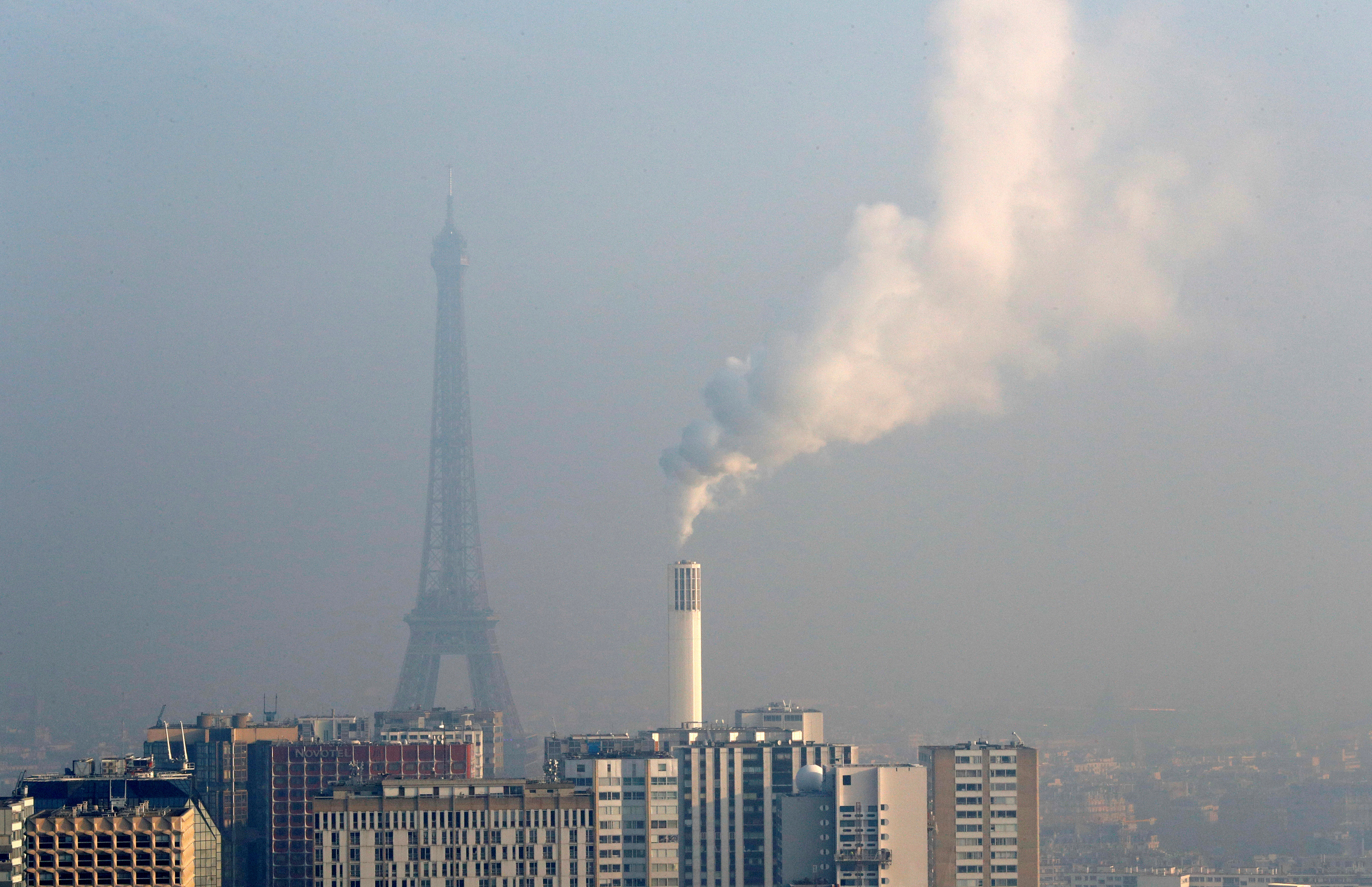 A view from the AirParif Generali balloon shows the Eiffel Tower through a small-particle haze as air pollution levels rise in Paris