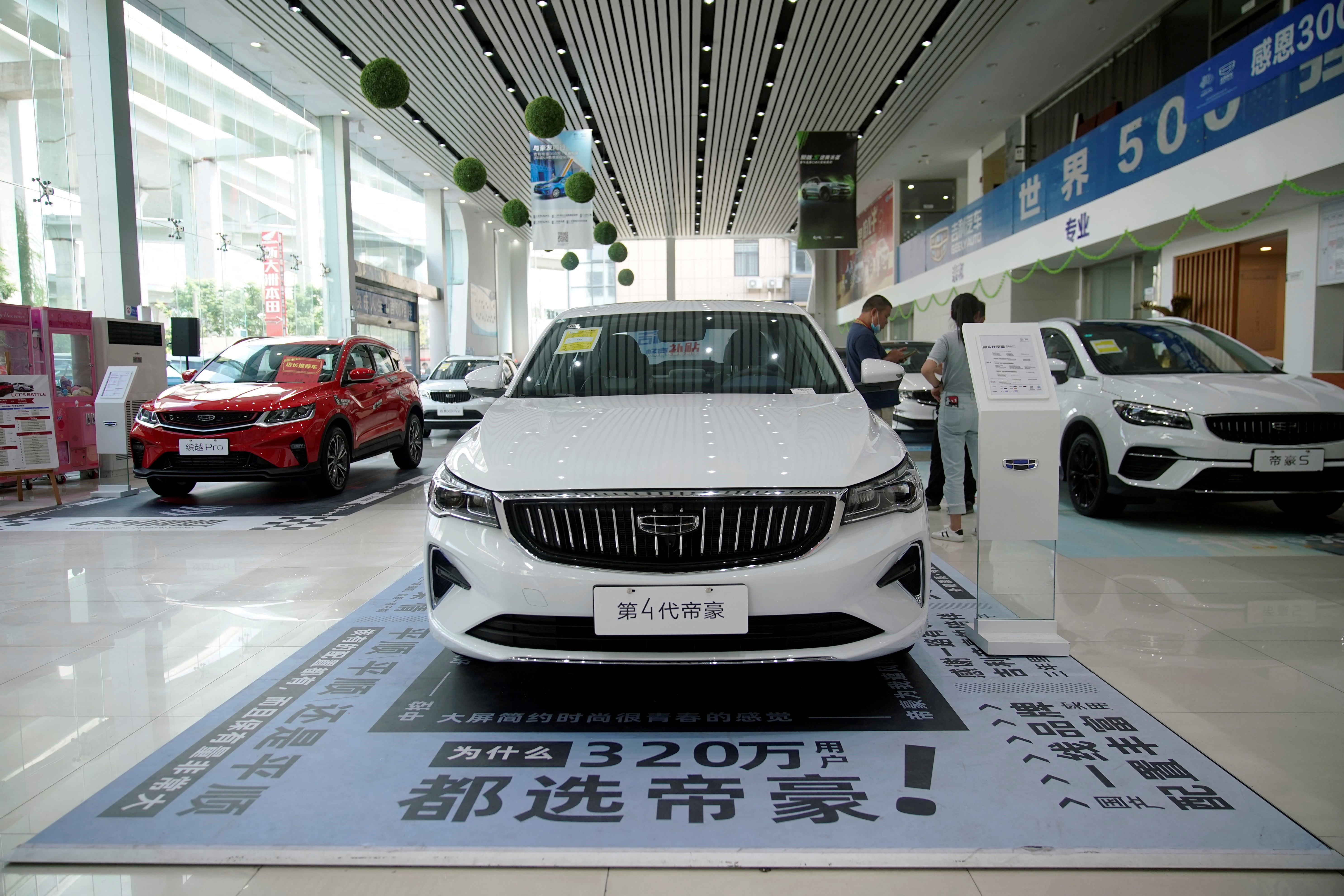 Geely vehicles are displayed at a car dealership in Shanghai