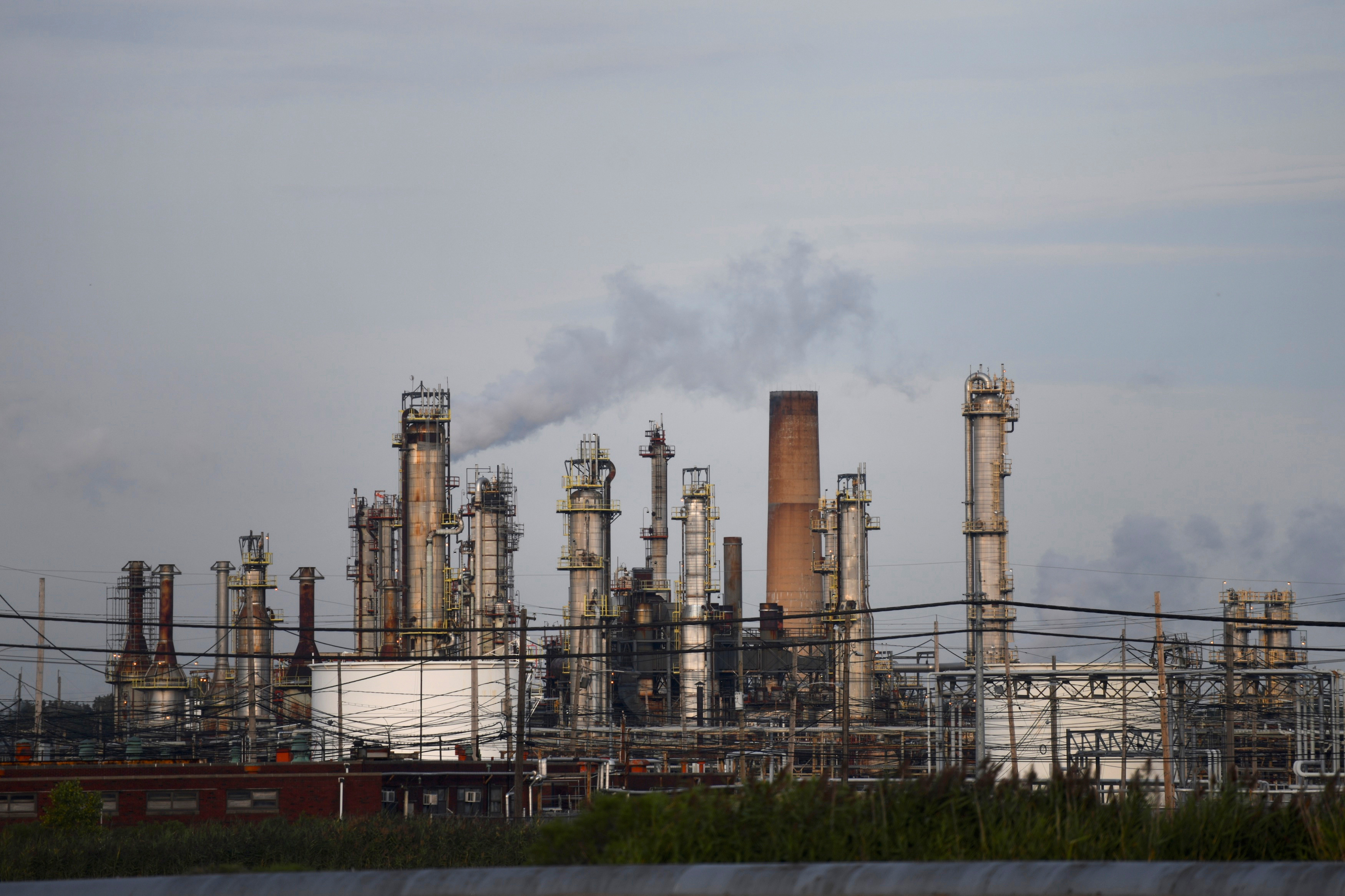 Smoke rises from oil refinery stacks at Philadelphia Energy Solutions plant in Philadelphia