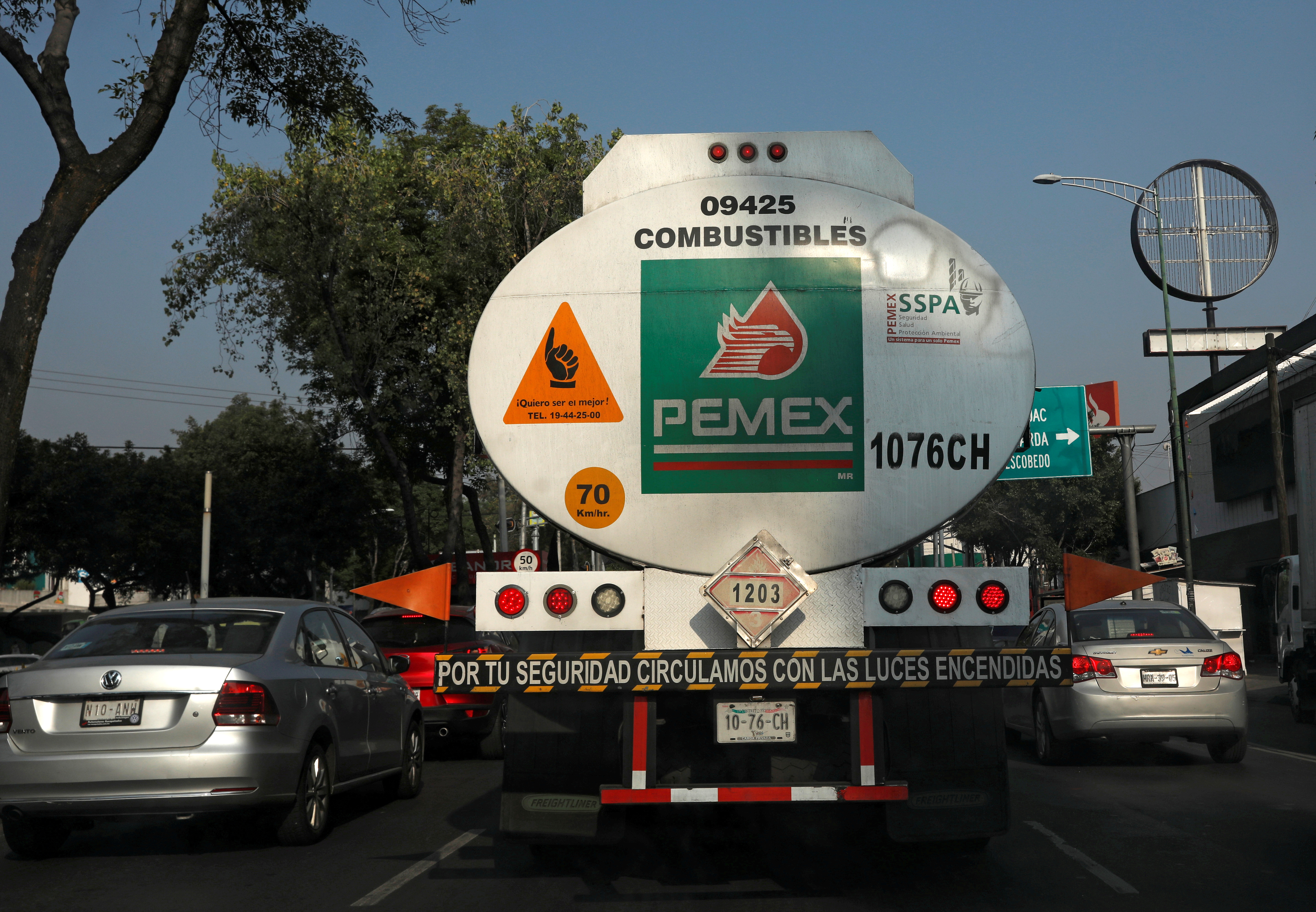 A tanker truck transporting fuel is pictured along the streets en route to a gas station, in Mexico City