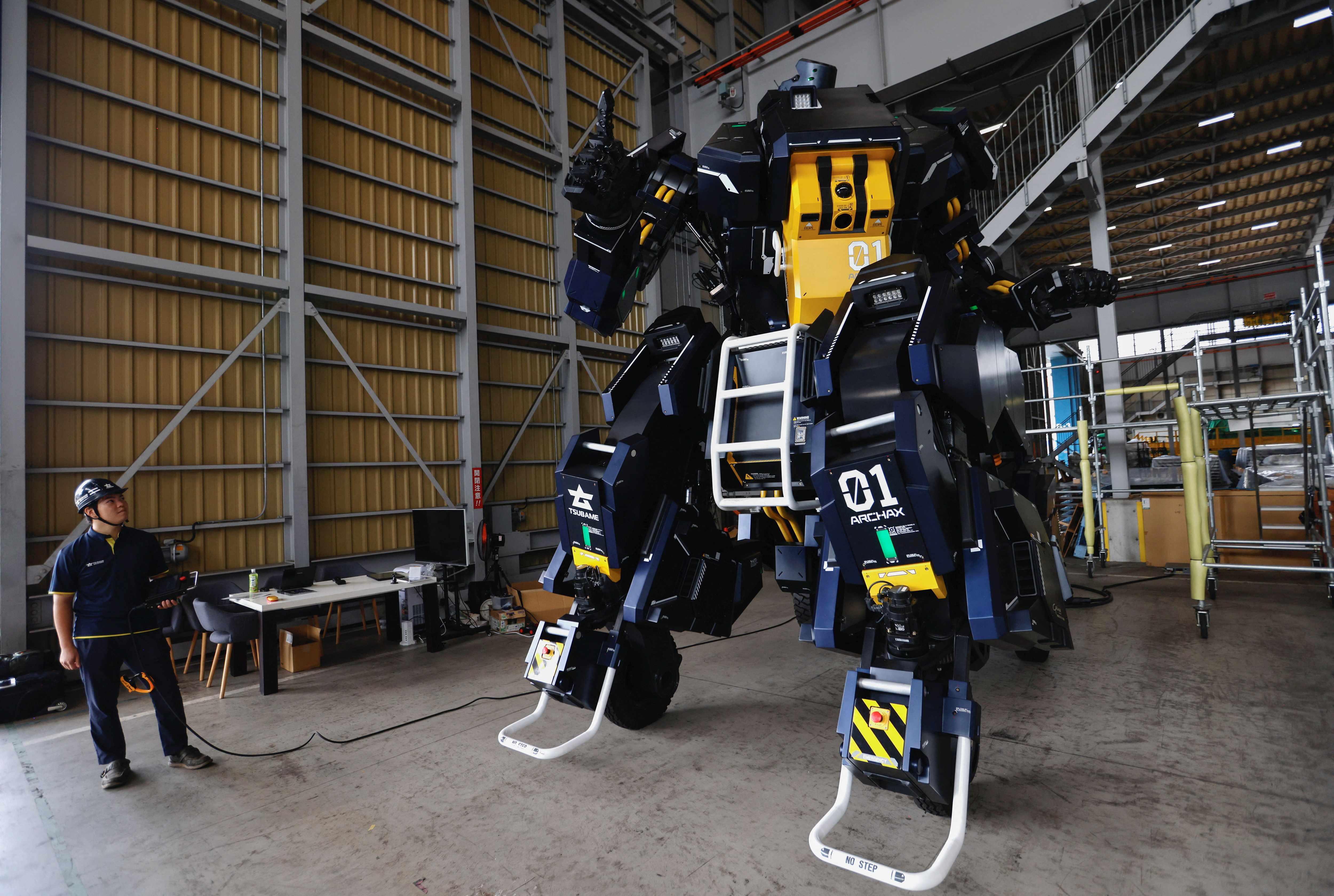 CEO Ryo Yoshida and CTO Akinori Ishii ARCHAX, a giant human-piloted robot, in Yokohama, Japan