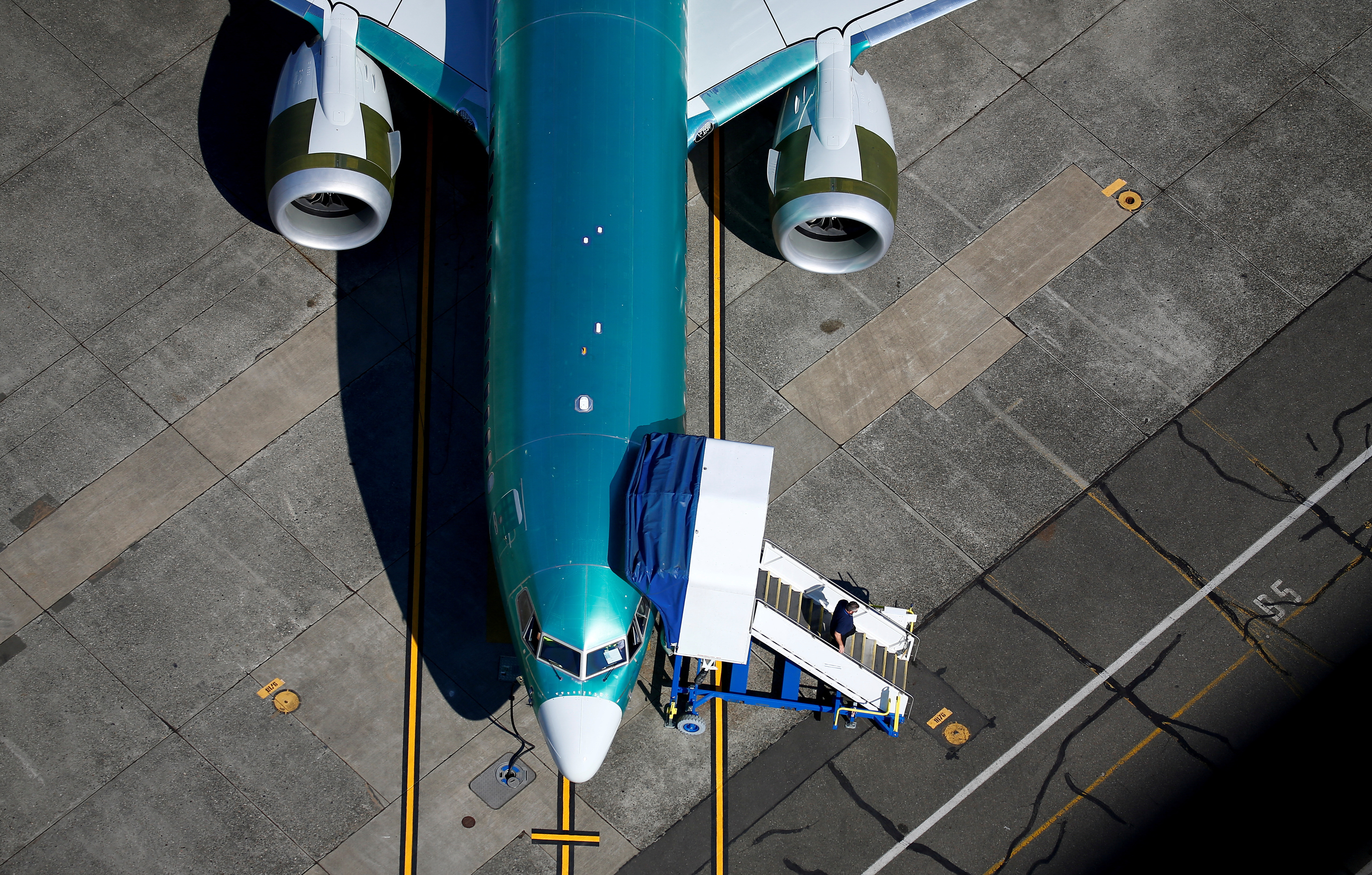 An unpainted Boeing 737 MAX aircraft is parked at Renton Municipal Airport near the Boeing Renton facility in Renton