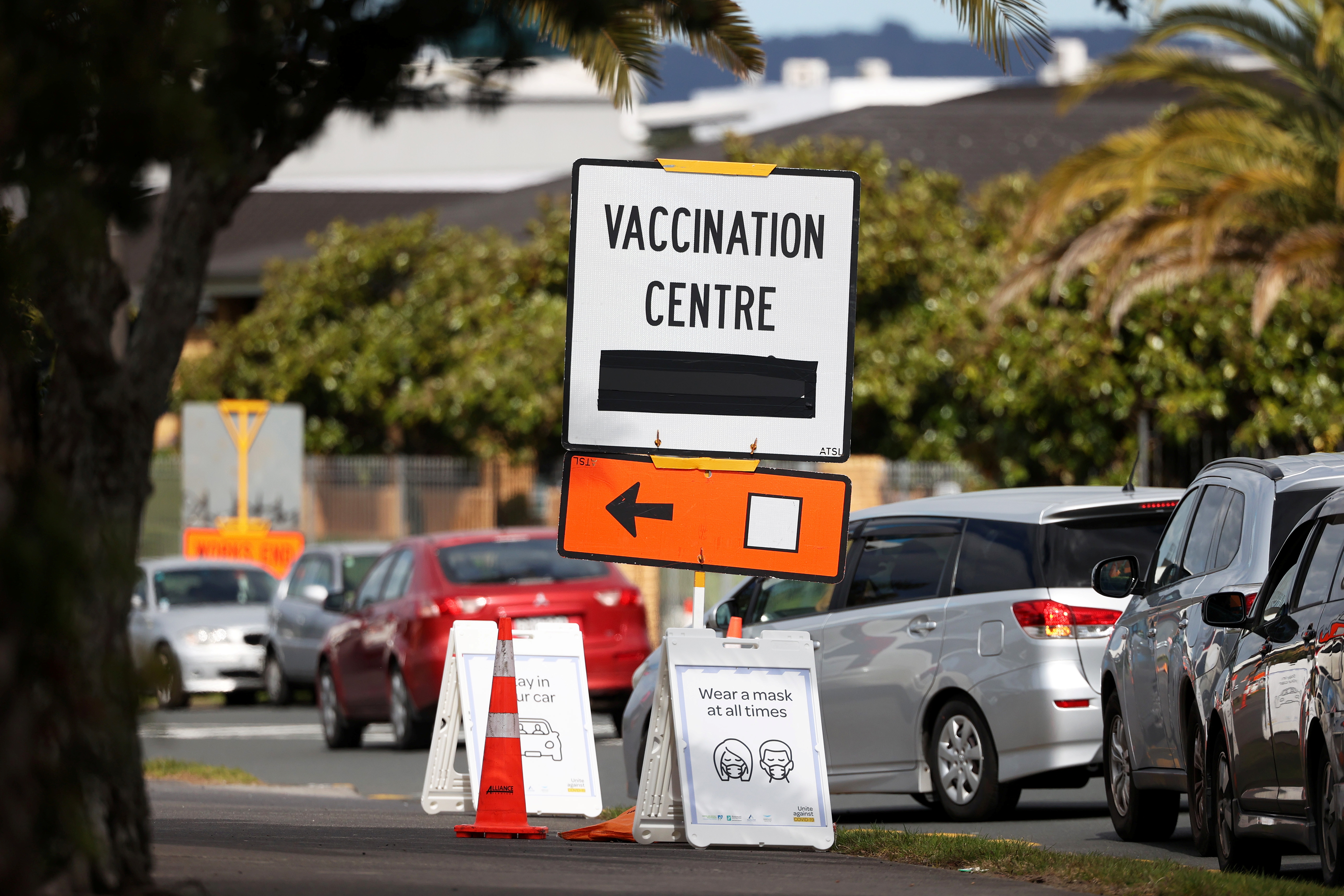 A vaccination centre sign directs the public during a lockdown to curb the spread of a coronavirus disease (COVID-19) outbreak in Auckland, New Zealand, August 26, 2021.  REUTERS/Fiona Goodall