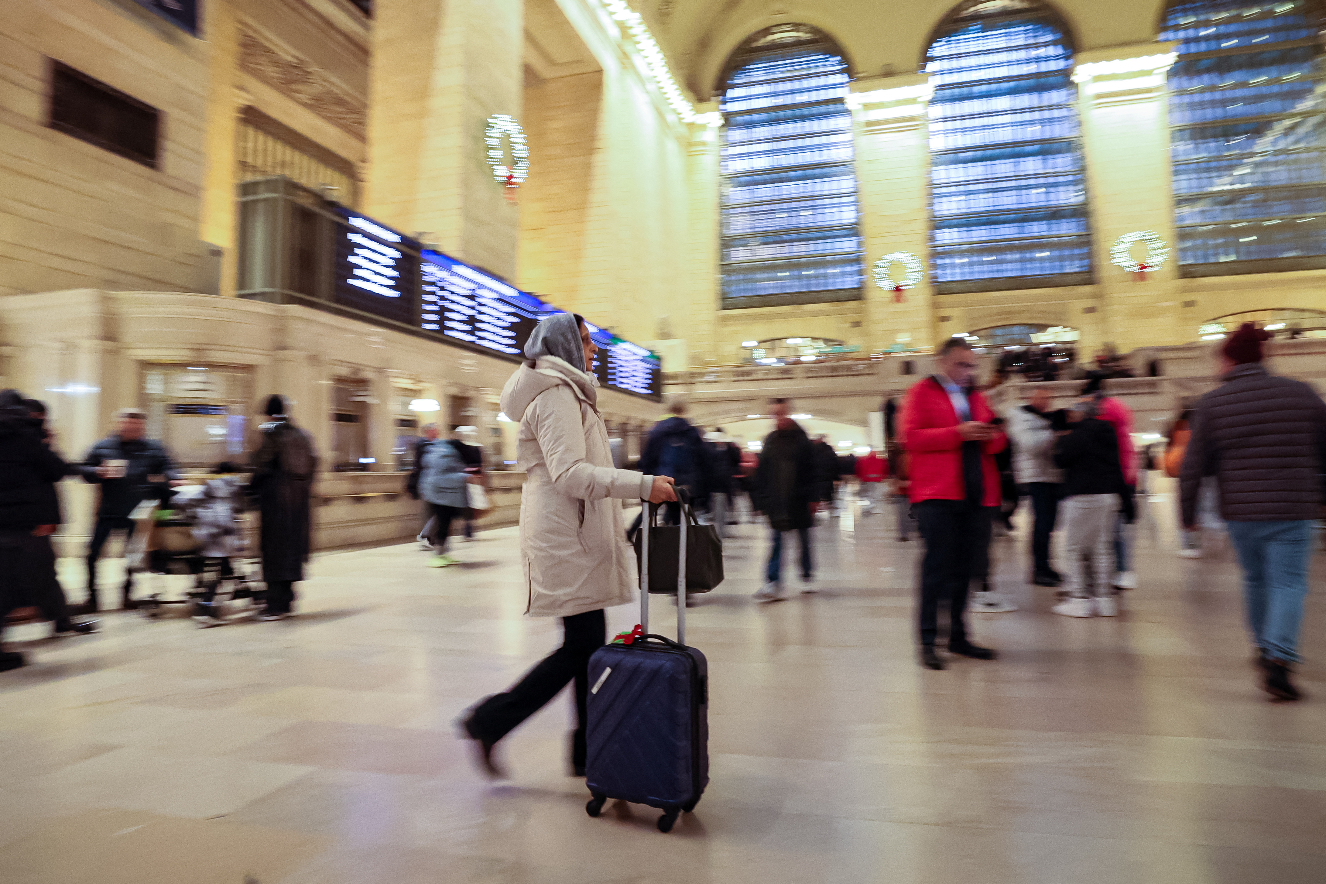 Travelers navigate through Grand Central Terminal, as people begin to travel ahead of the Thanksgiving holiday,  in New York
