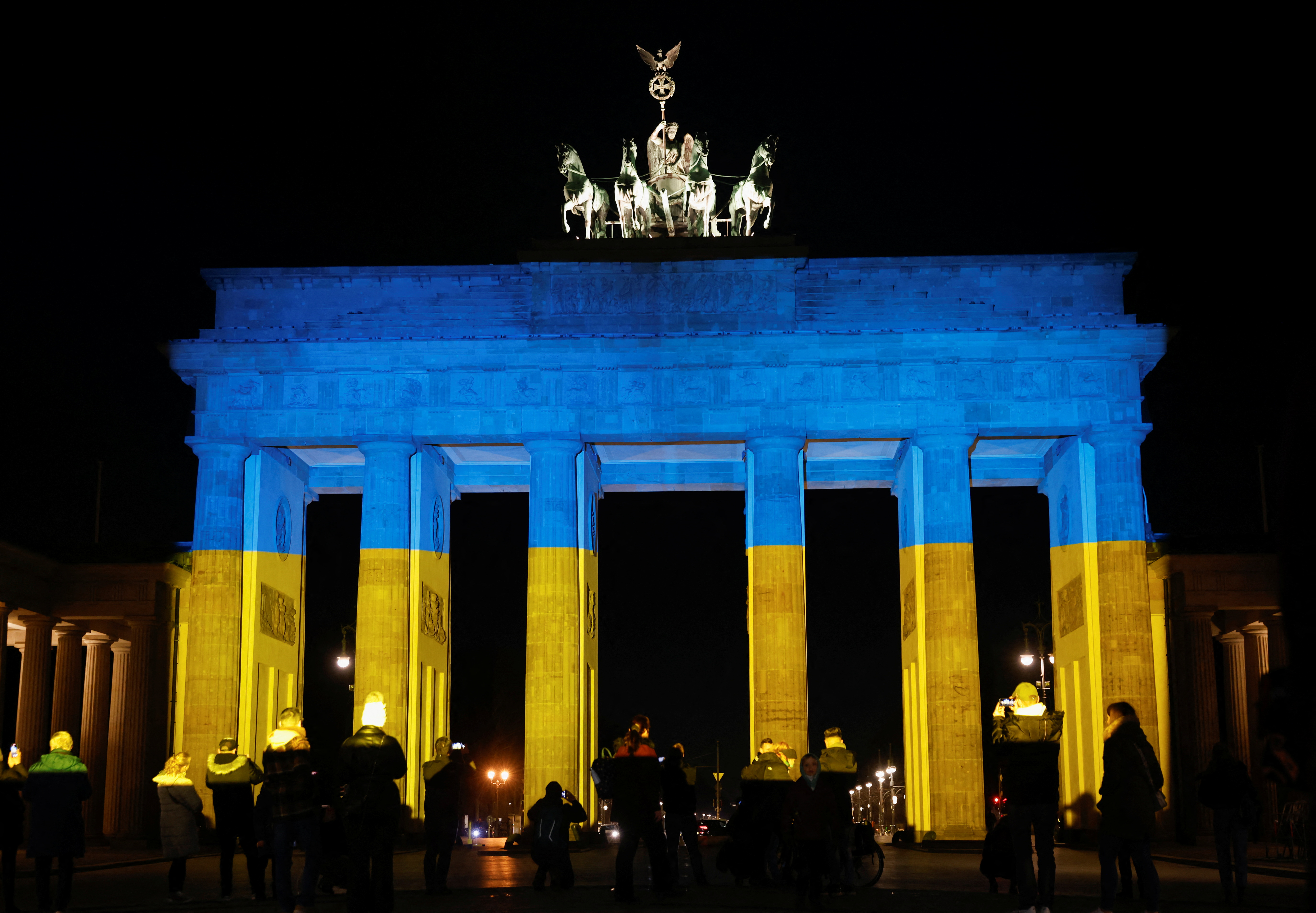 Brandenburg Gate is illuminated in Ukrainian national colors, in Berlin