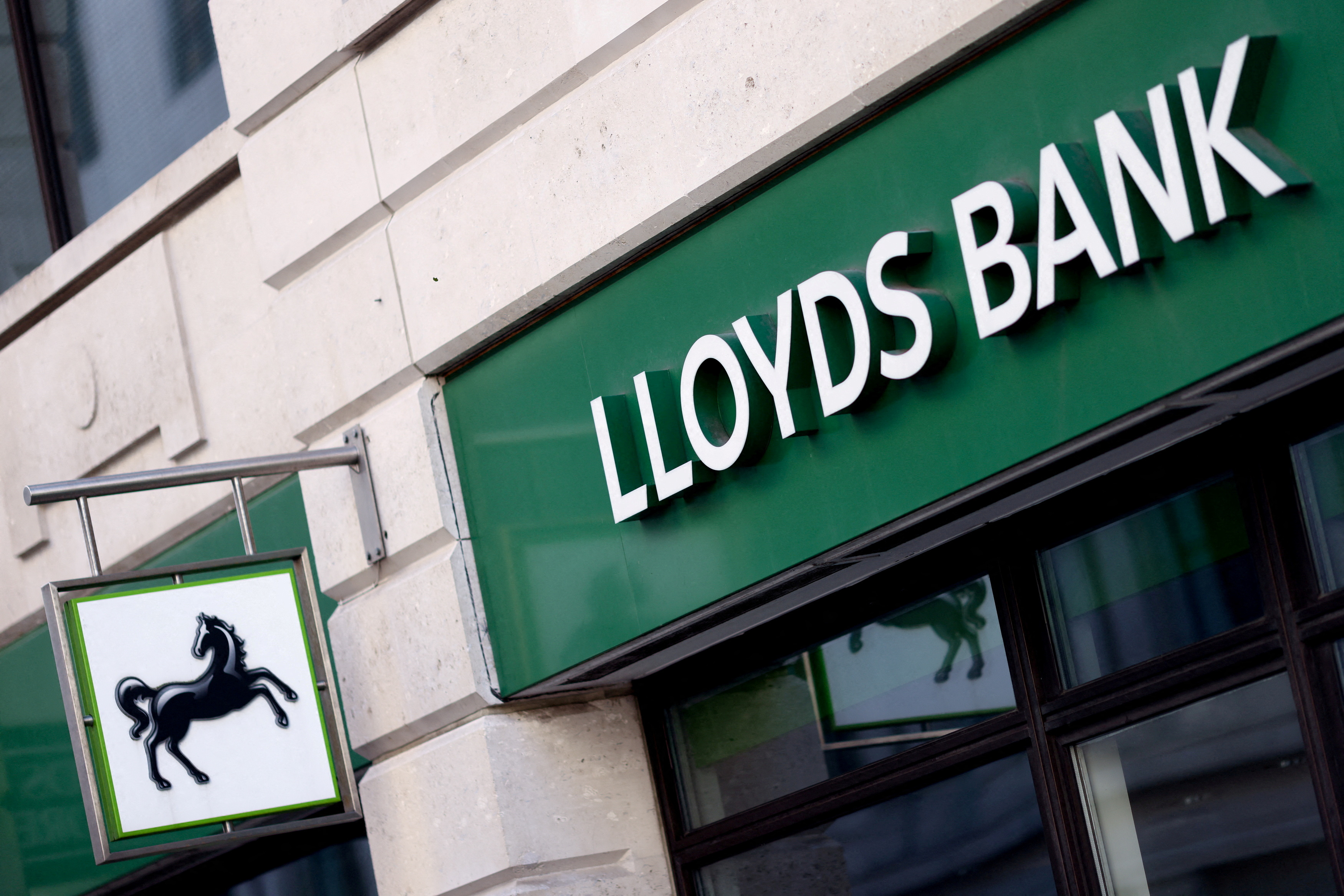 General view of signage at a branch of Lloyds bank, in London