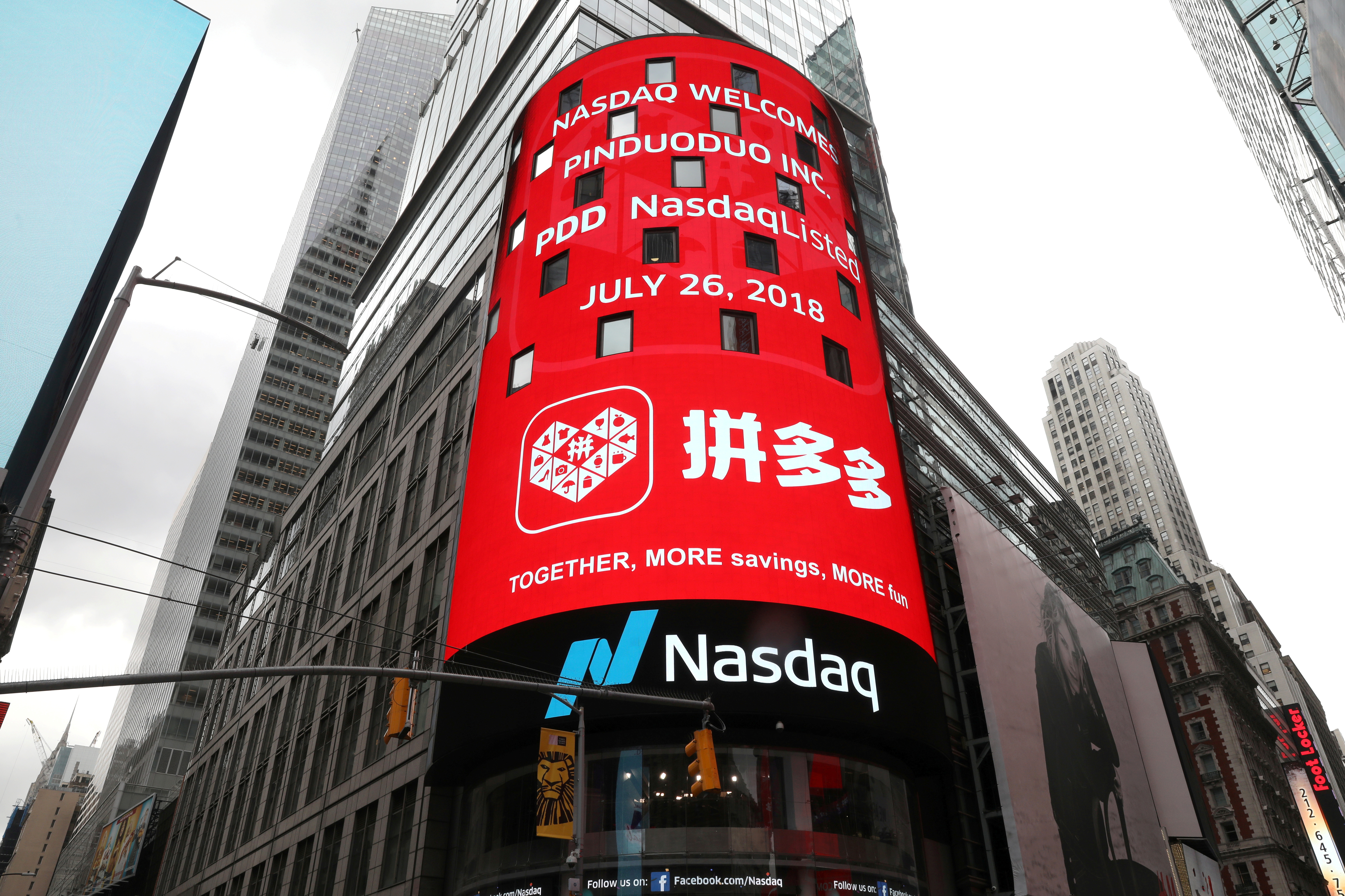 A display at the Nasdaq Market Site shows a message after Chinese online group discounter Pinduoduo Inc. (PDD) was listed on the Nasdaq exchange in Times Square in New York City