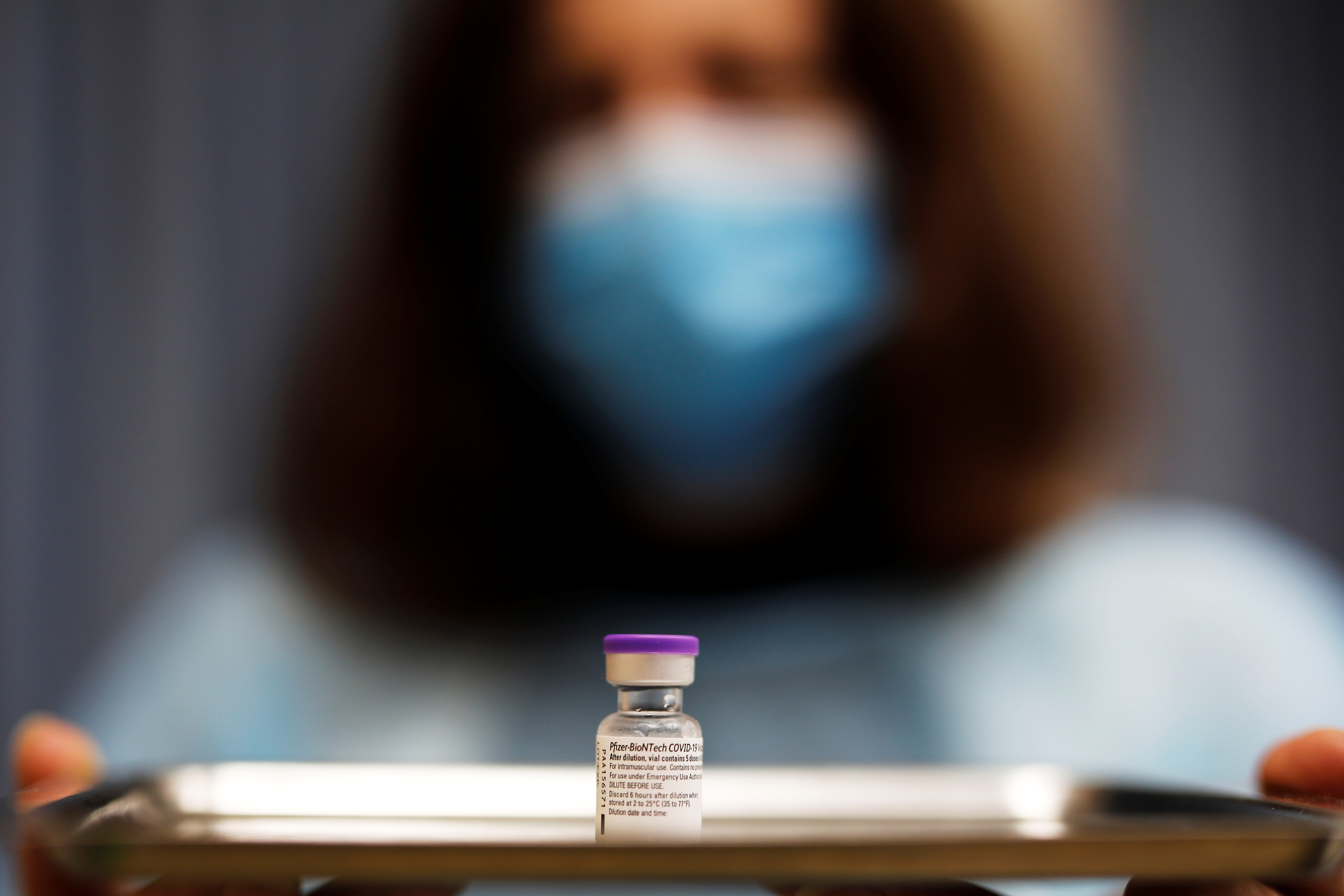 A medical worker holds a tray with a vial of the vaccination against the coronavirus disease (COVID-19) as Israel continues its national vaccination drive, during a third national COVID lockdown, in Ashdod
