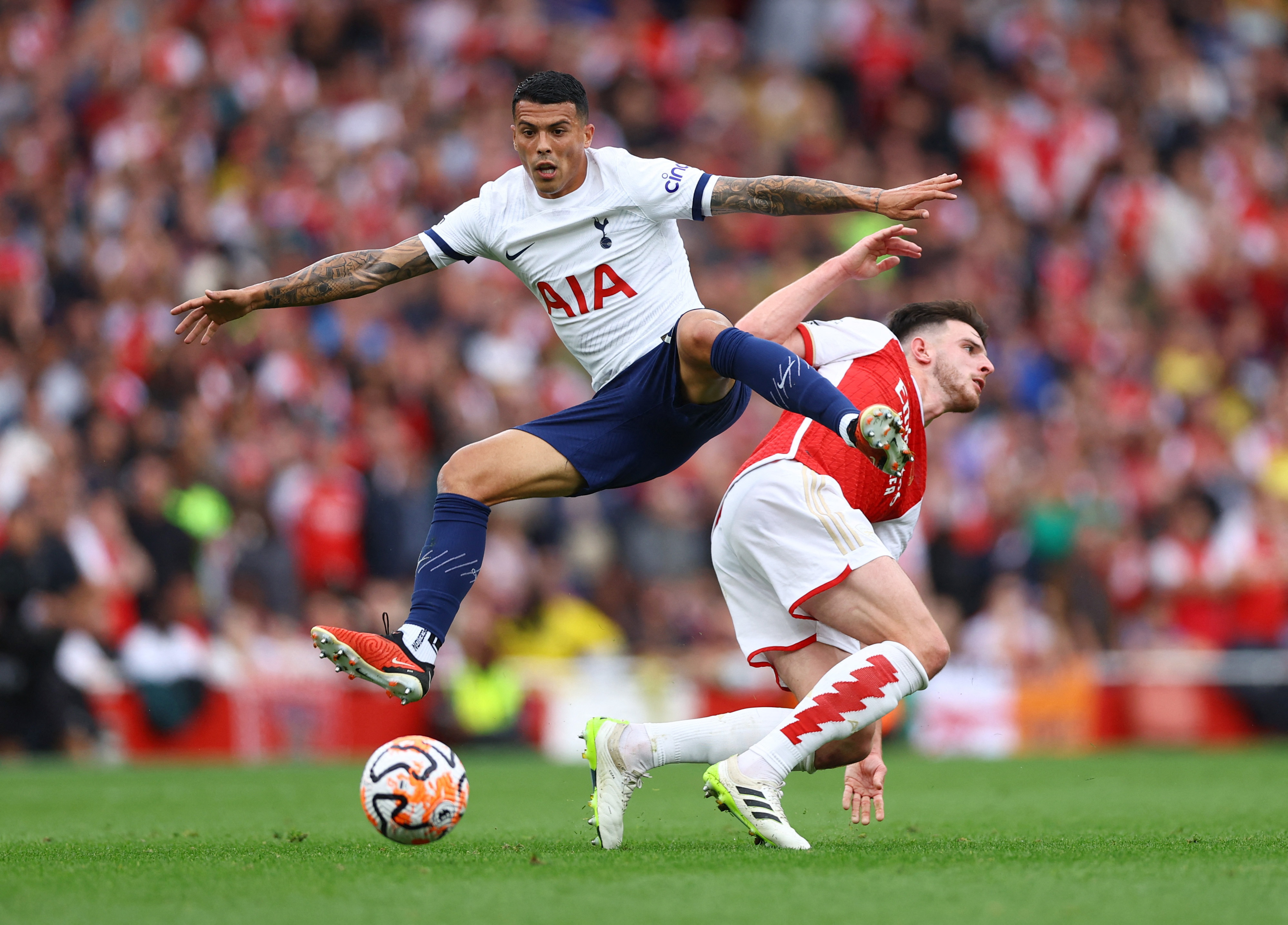 Son's double earns Tottenham 2-2 draw at Arsenal