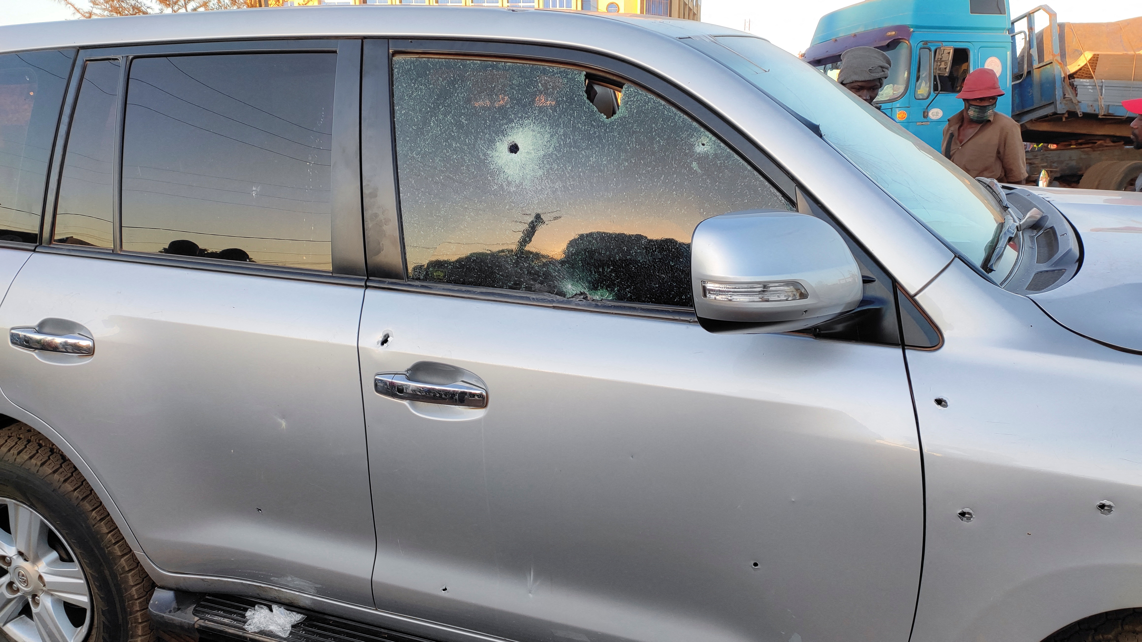 Bullet holes are seen in a car that belong to presidency  following heavy gunfire near the president Roch Kabore residence  in Ouagadougou