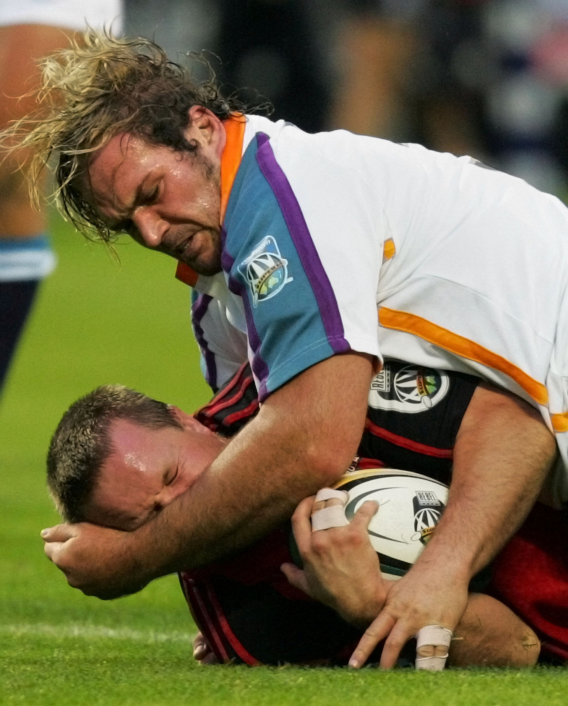 Crusaders' Johnstone gets hit in high tackle from Cheetahs' du Plessis during their Super 14 rugby clash in Christchurch