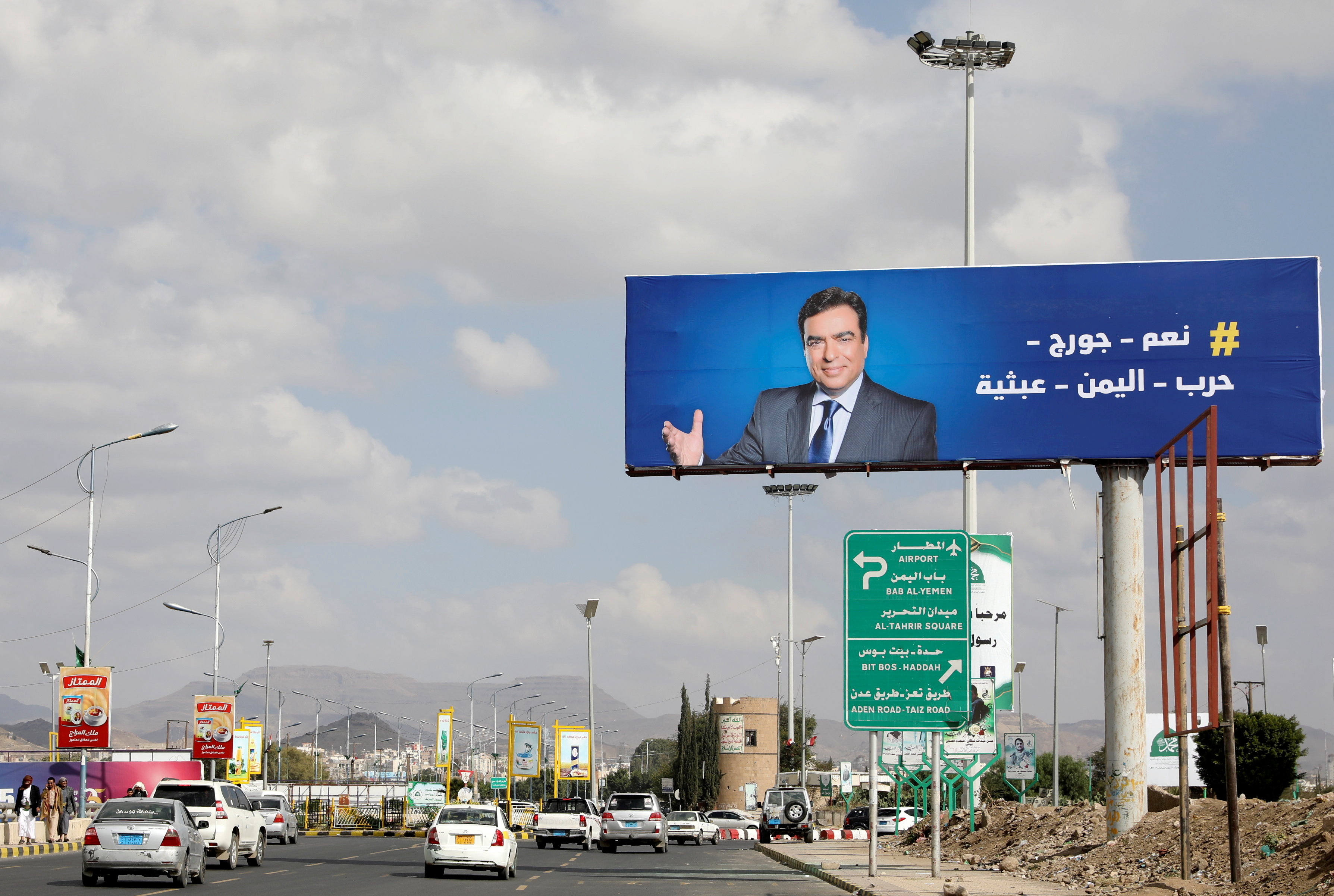 Poster of Lebanese Information Minister George Kordahi is seen on billboard in Sanaa, Yemen