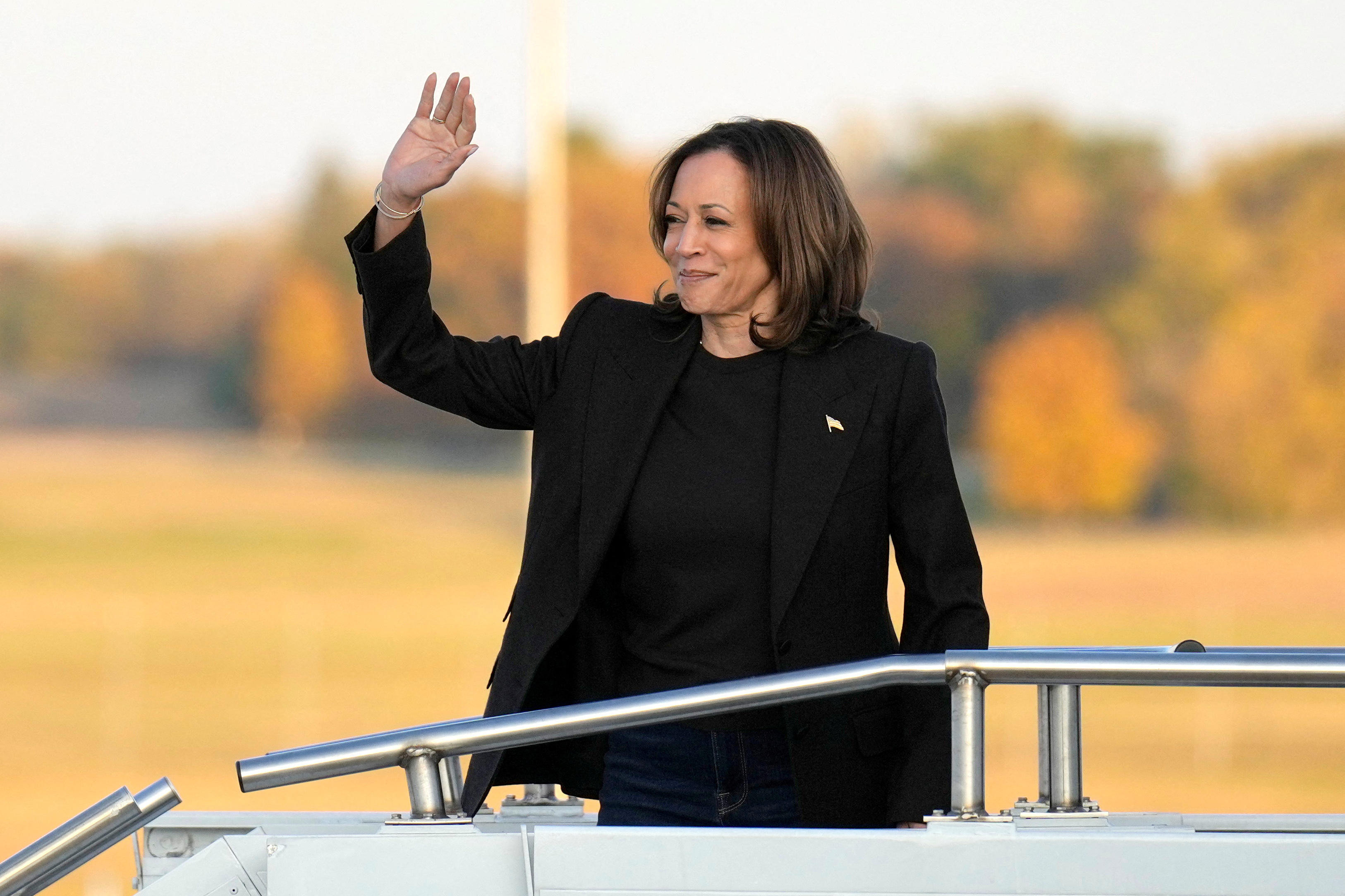 Democratic presidential nominee and U.S. Vice President Kamala Harris  boards Air Force Two at Capital Region International Airport in Lansing