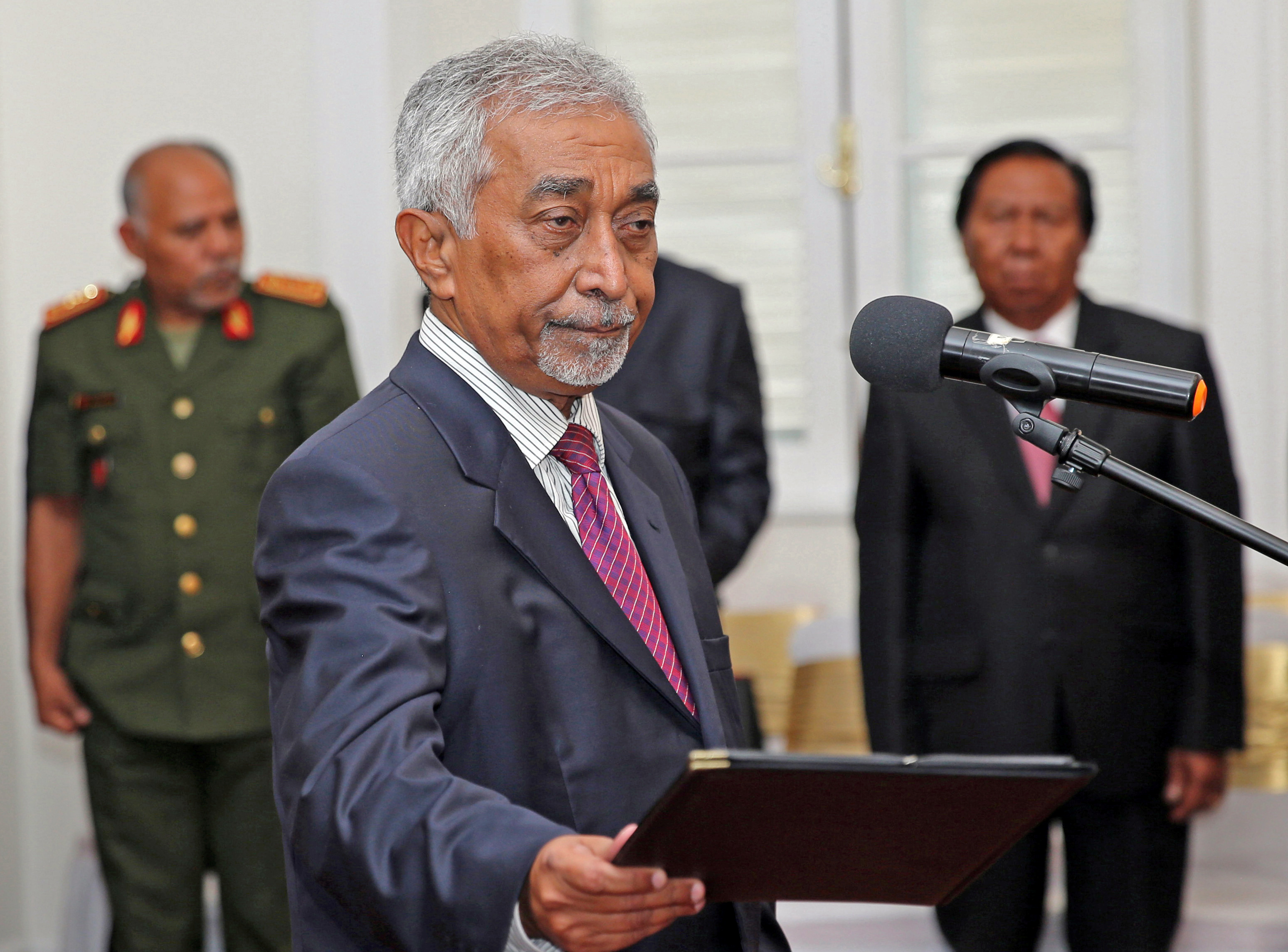 East Timor Prime Minister Mari Alkatiri stands during his swearing-in ceremony in Dili