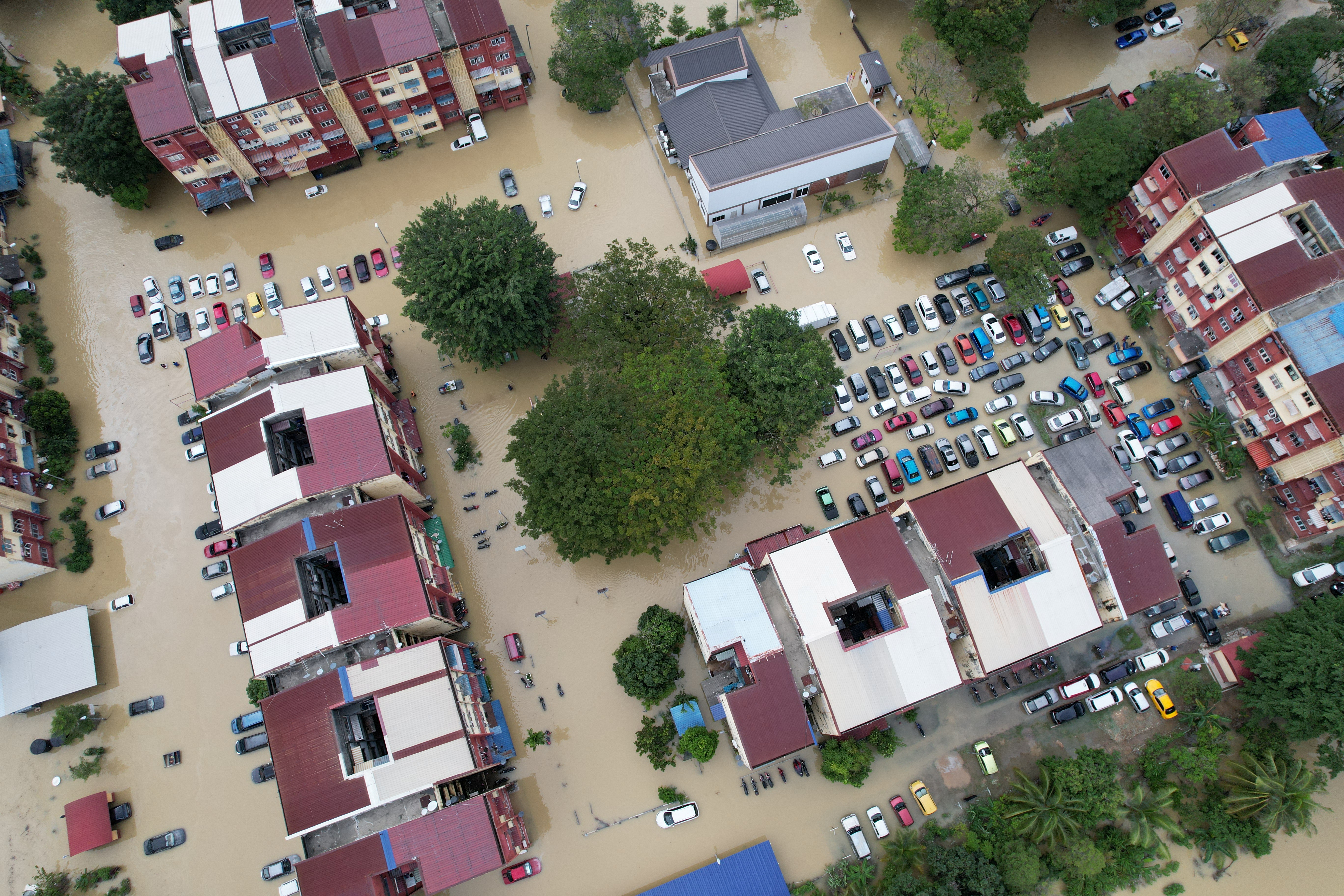 A view of buildings and vehicles submerged in flood waters in Shah Alam, Selangor
