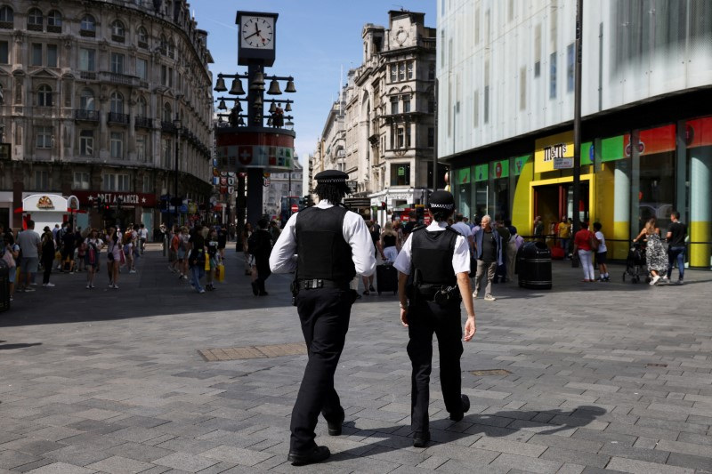 Police are seen in Leicester Square after knife attack