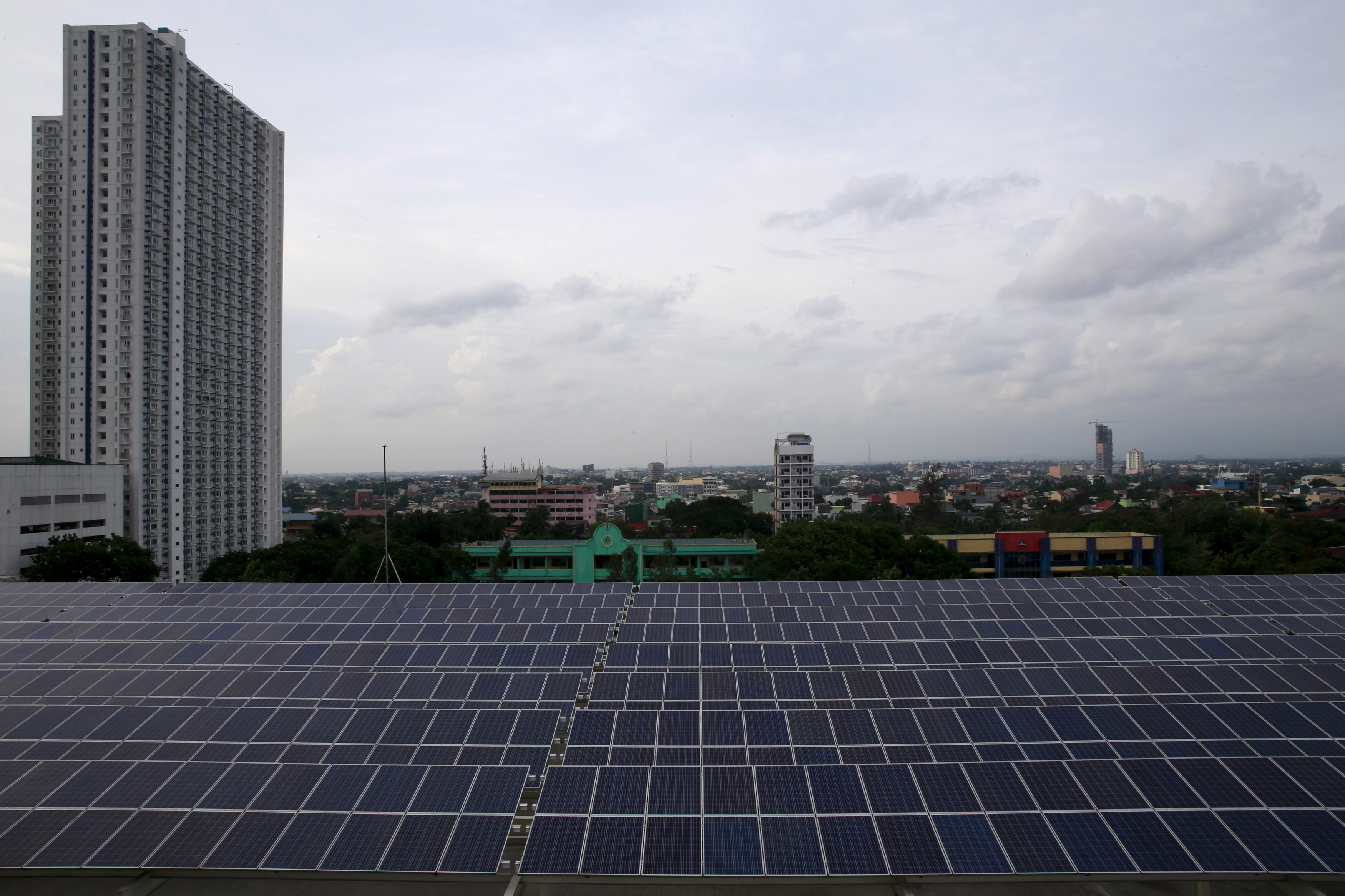 Solar panels are seen on the roof deck of a mall in Quezon city, metro Manila