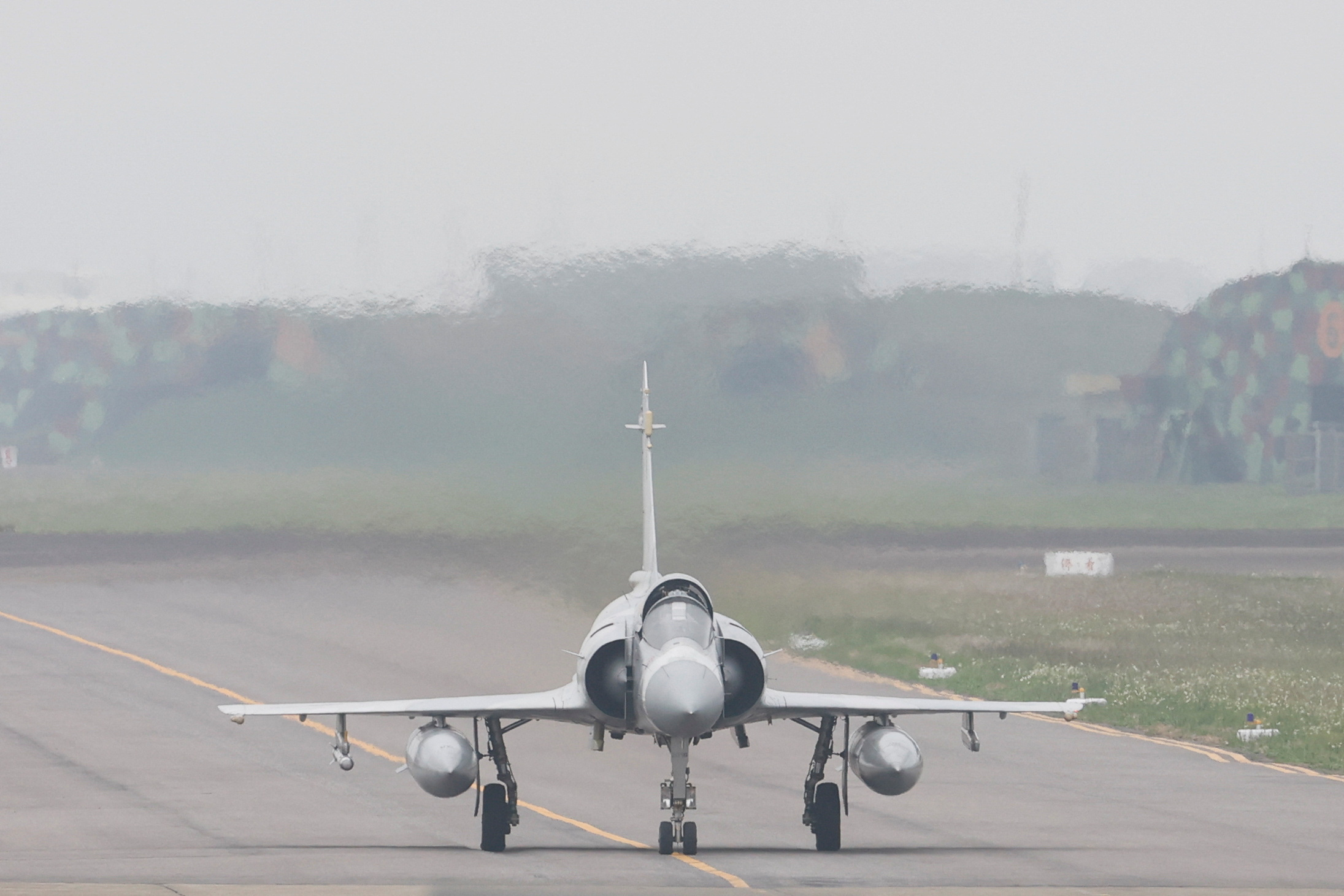 A Taiwan Air Force Mirage 2000 aircraft drives in the runway before taking off at Hsinchu Air Base in Hsinchu