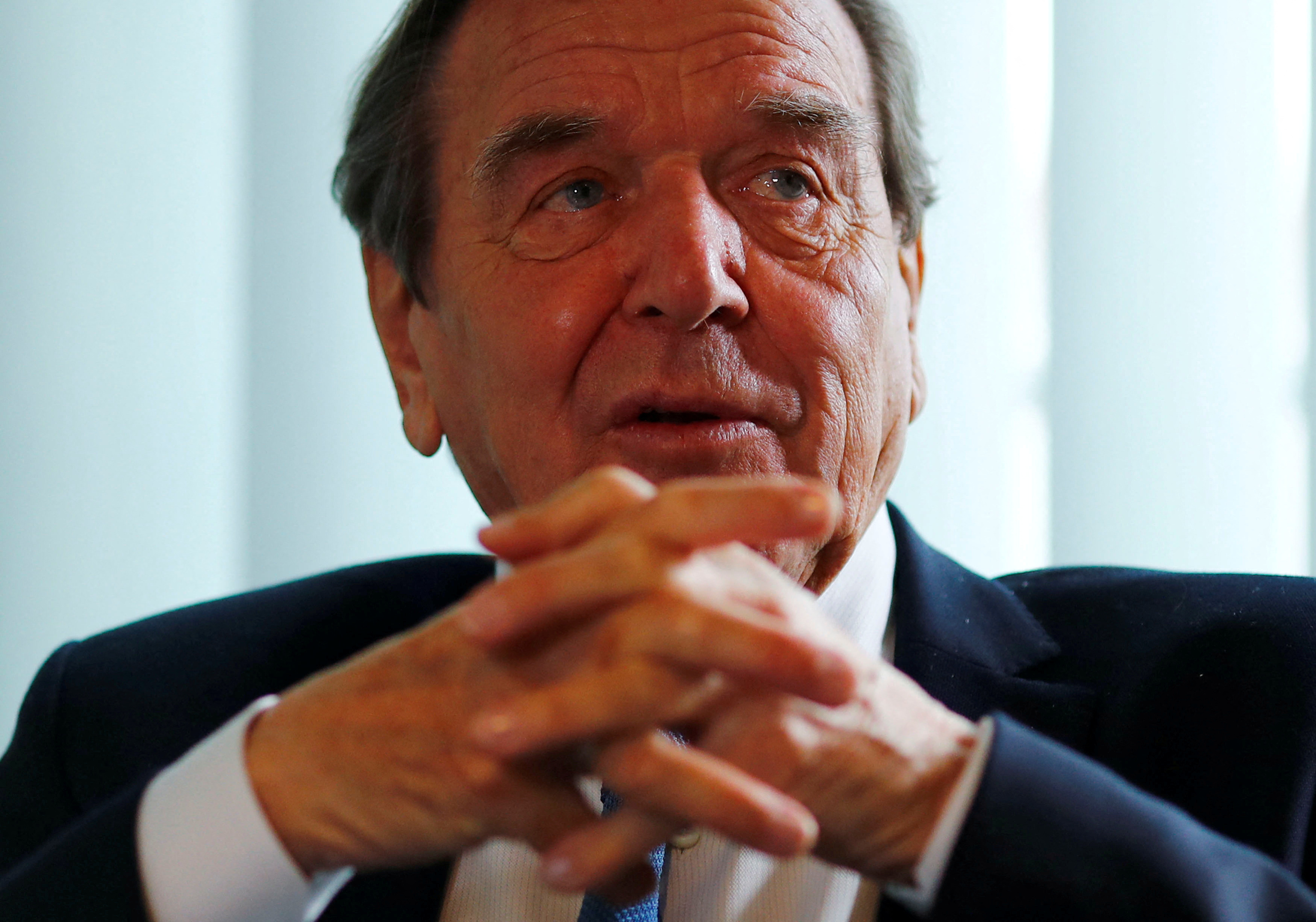 Former German Chancellor Gerhard Schroeder is pictured during an interview with Reuters in his office in Berlin