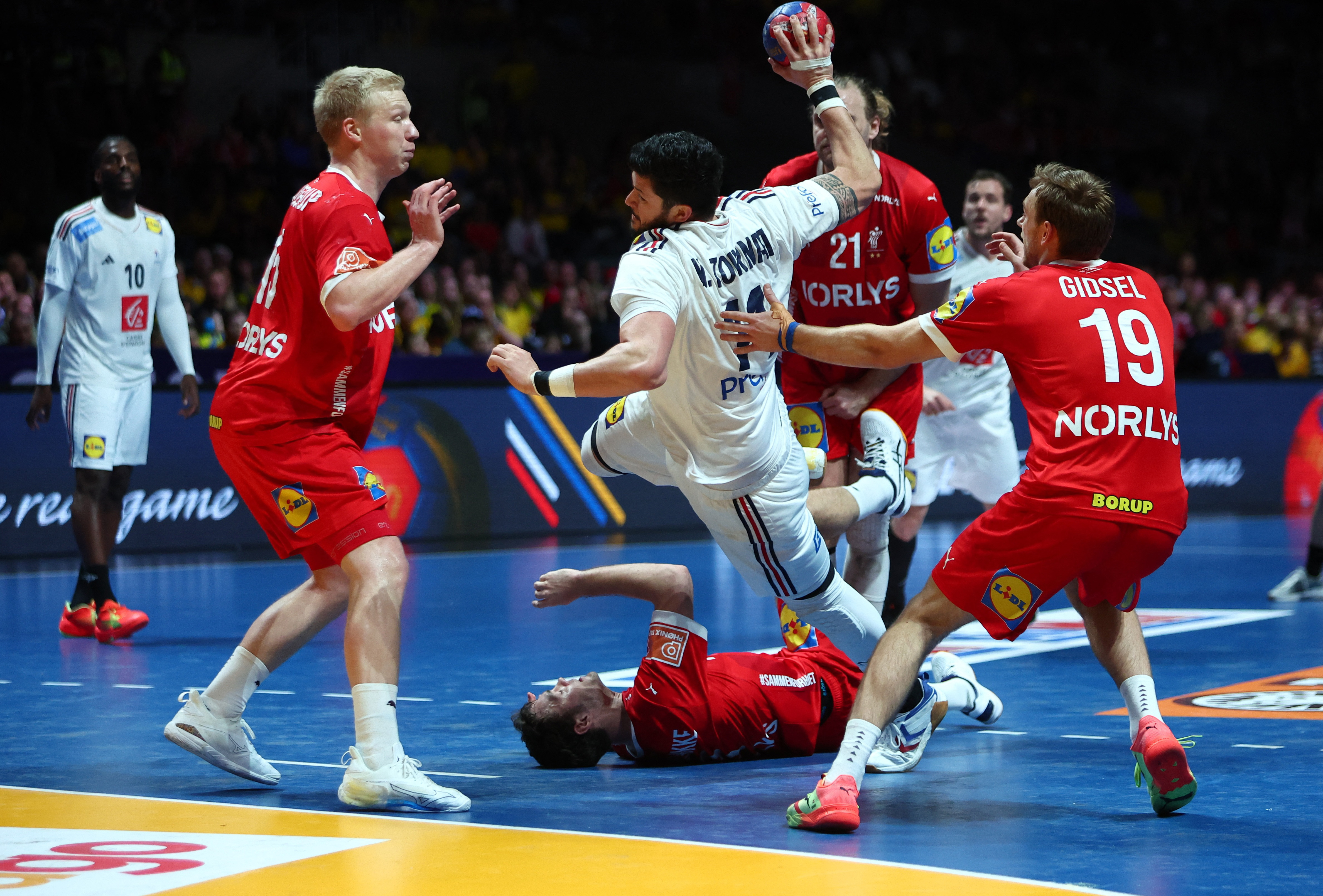 Denmark beat France to historic third handball world title