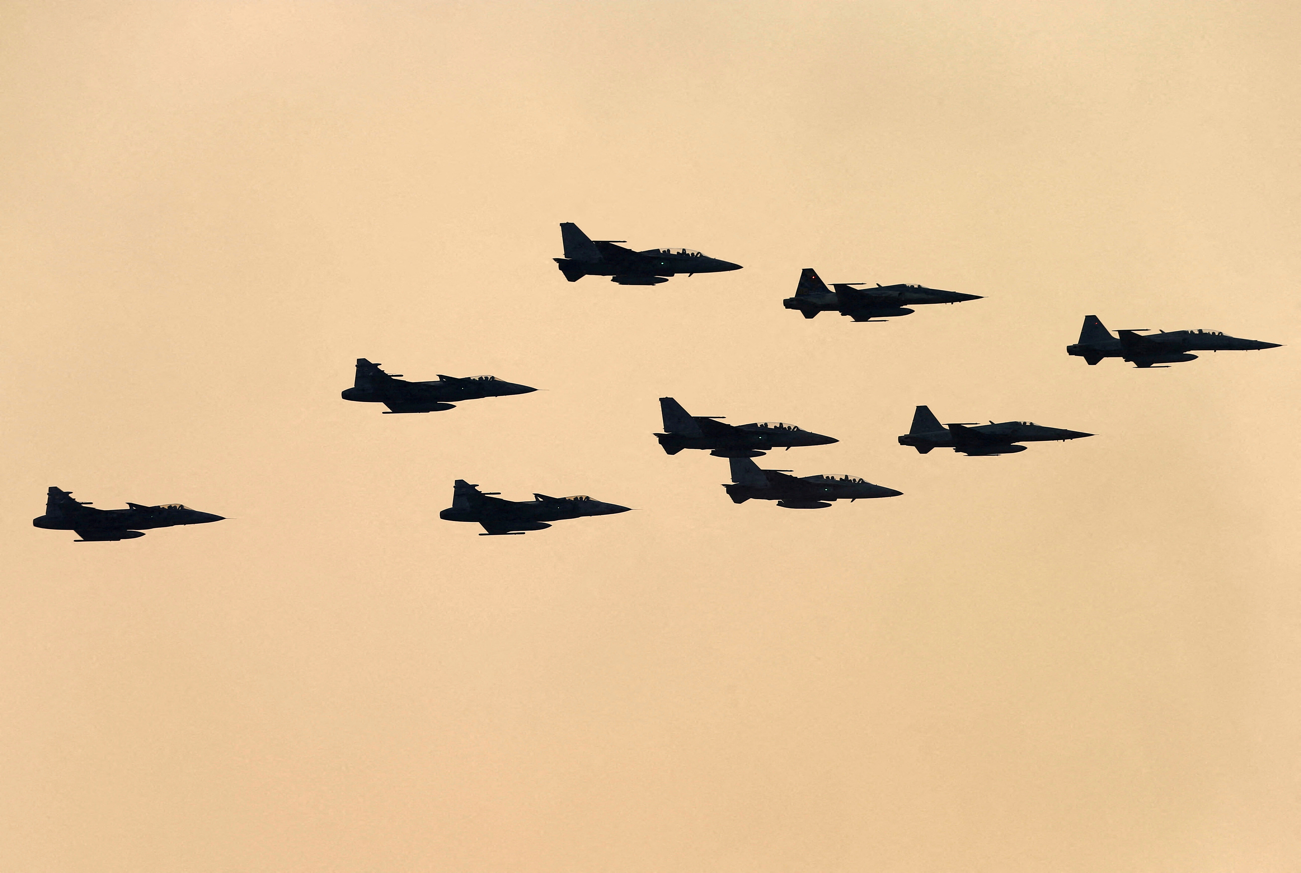 Fighter jets fly during the annual Military Parade to celebrate the Coronation of King Rama X at the Royal Thai Army Cavalry Center in Saraburi province