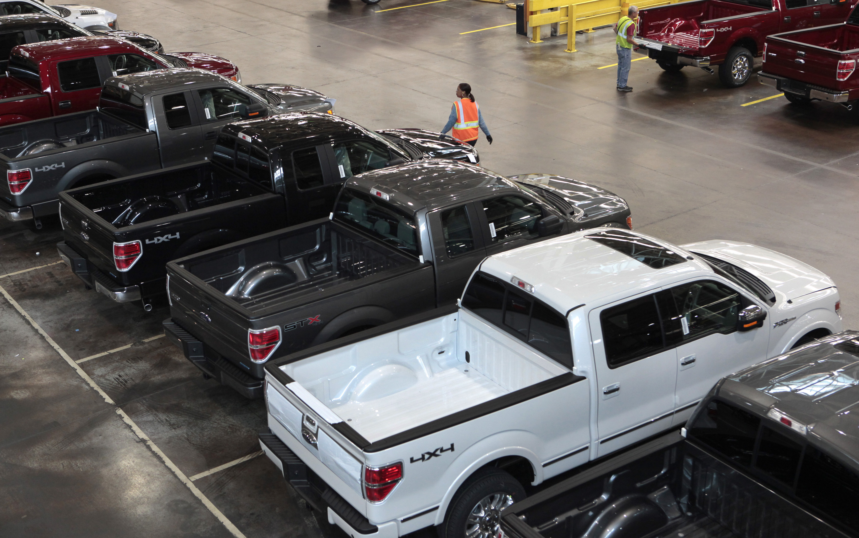 2014 Ford F-150 pick-up trucks are seen inside the plant at the Ford Motor Dearborn Truck Plant in Dearborn, Michigan