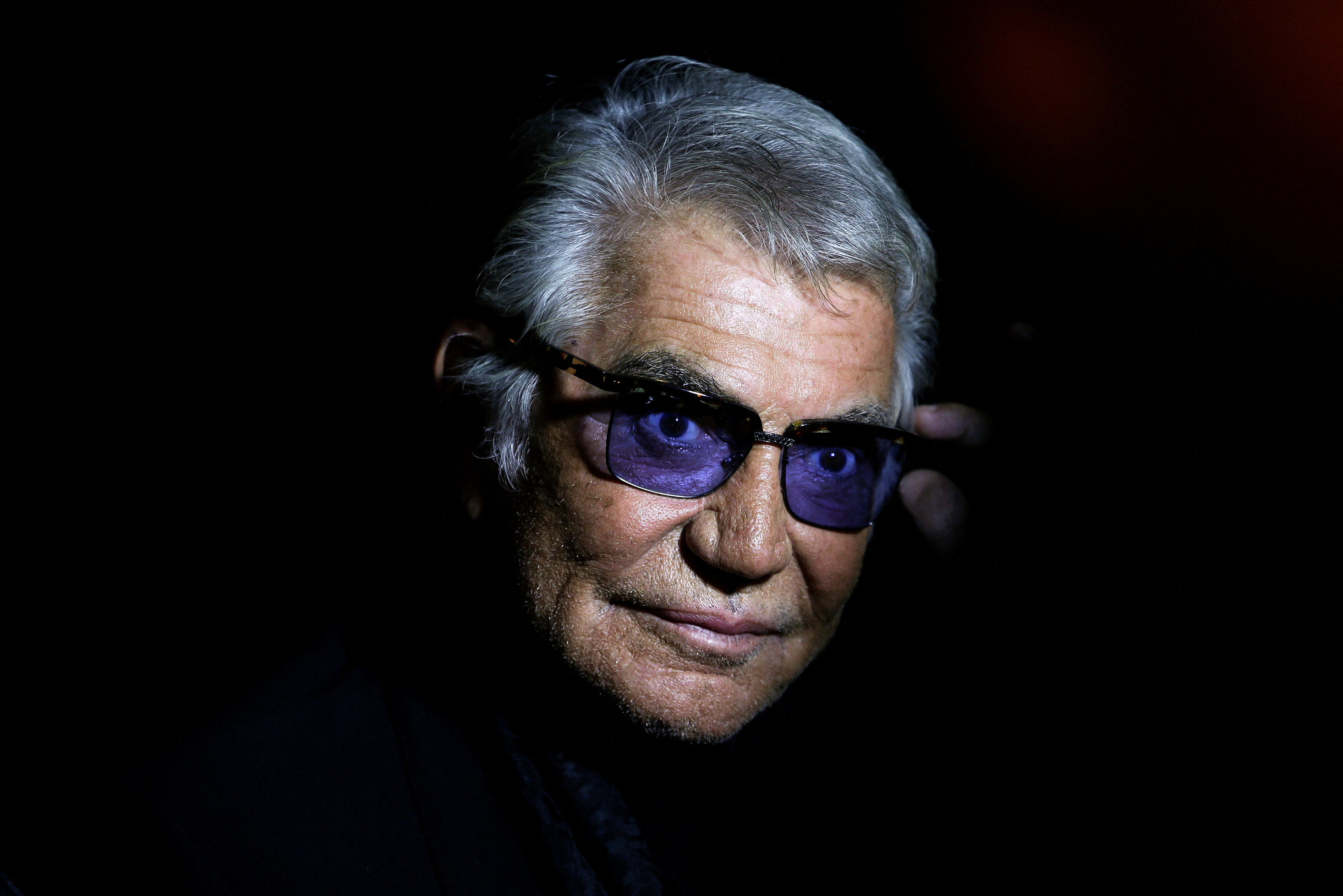 Cavalli poses before the start of his Spring/Summer 2014 collection during Milan Fashion Week
