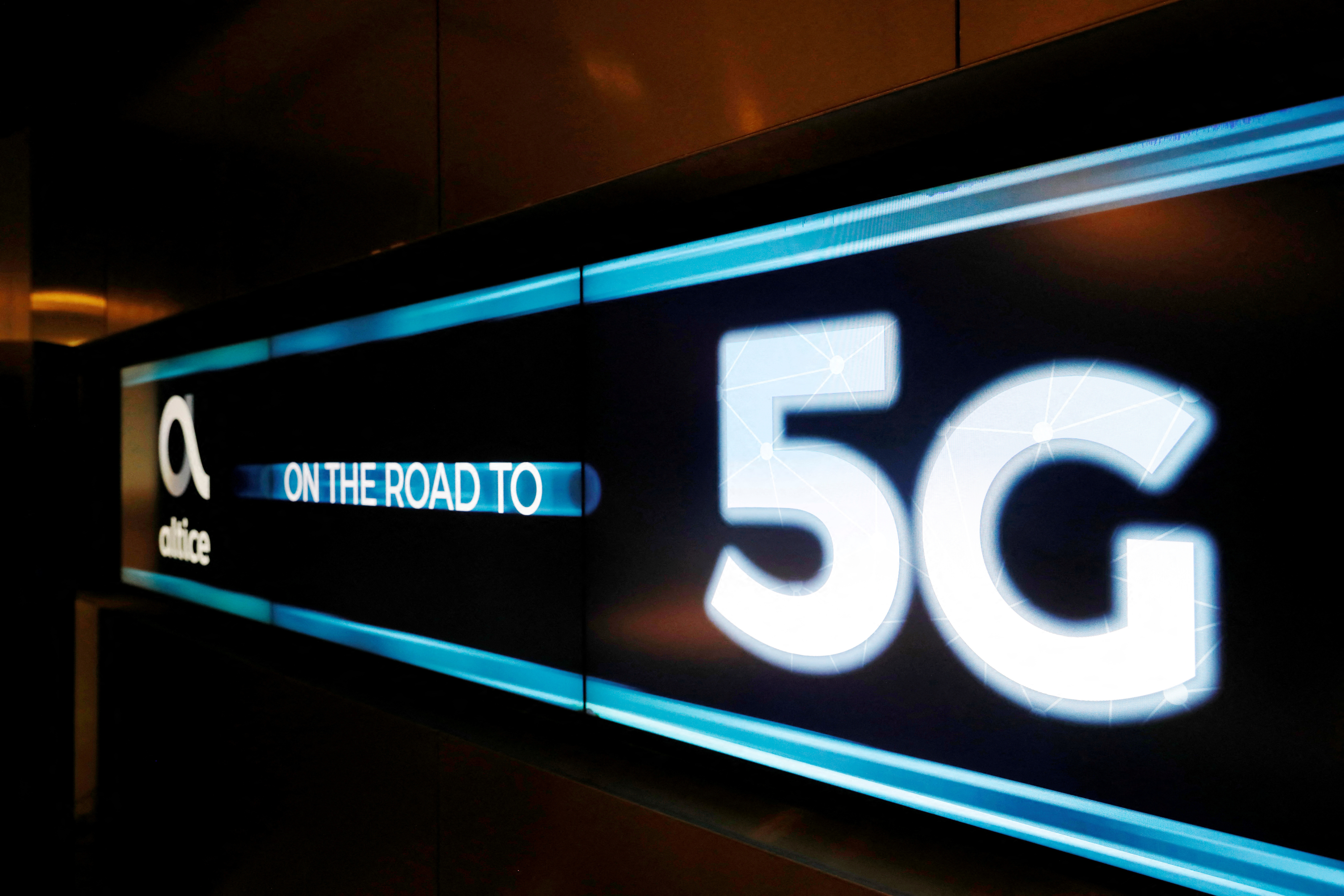 An advertising board is seen during the first demonstration of the technology 5G in Lisbon