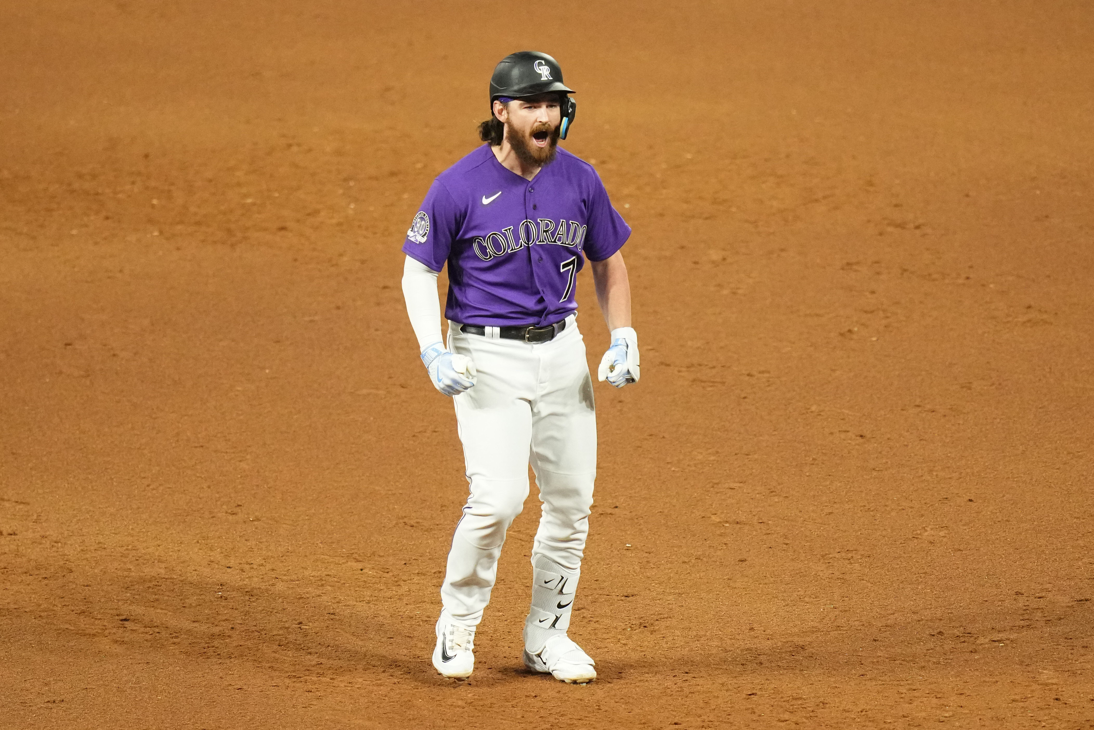 DENVER, CO - JUNE 14: Colorado Rockies right fielder Charlie Blackmon (19)  advances to third base in the tenth inning during a game between the  Cleveland Guardians and the Colorado Rockies at