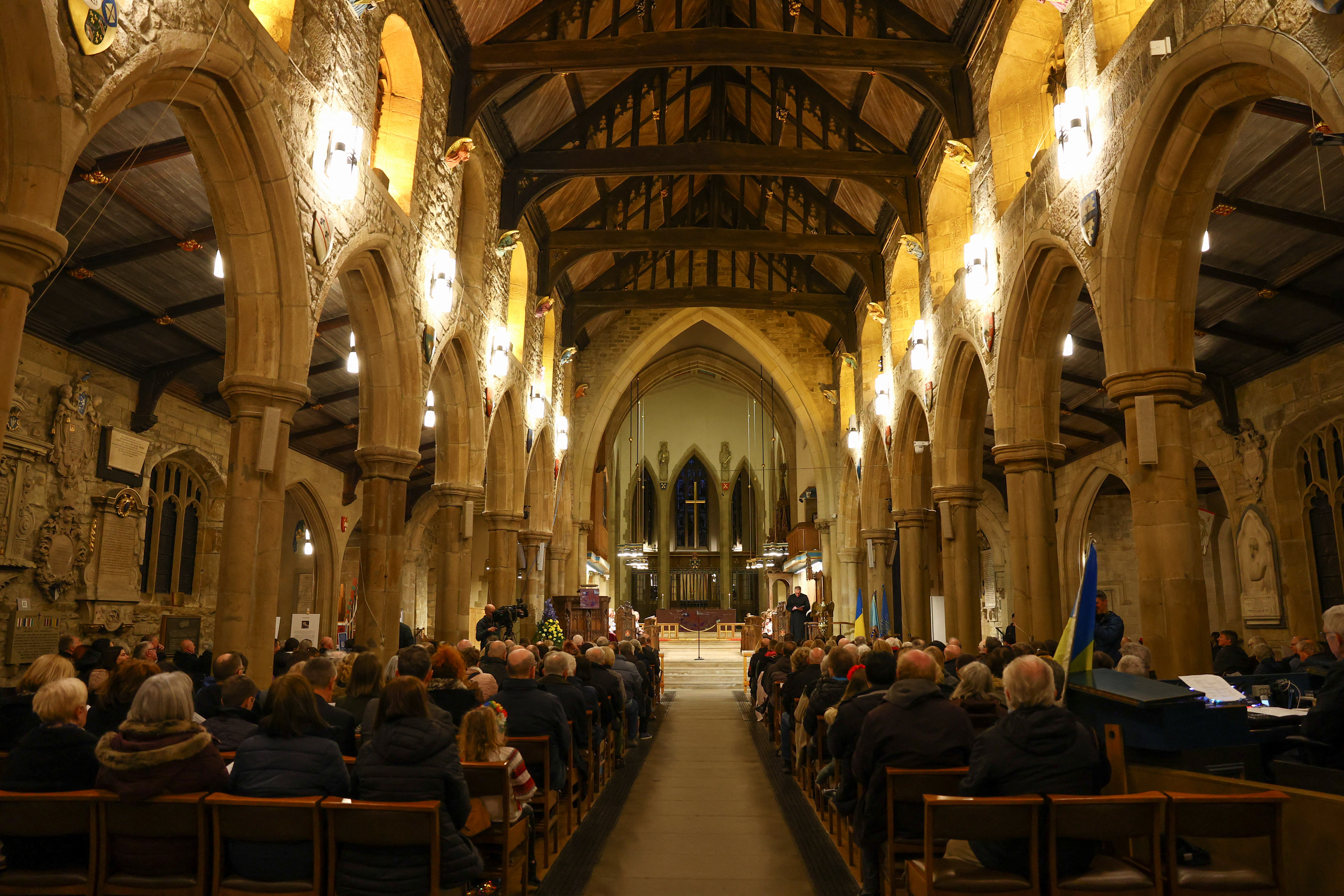 Members of the congregation attend a prayer vigil marking the first anniversary of Russia's invasion of Ukraine at Bradford Cathedral