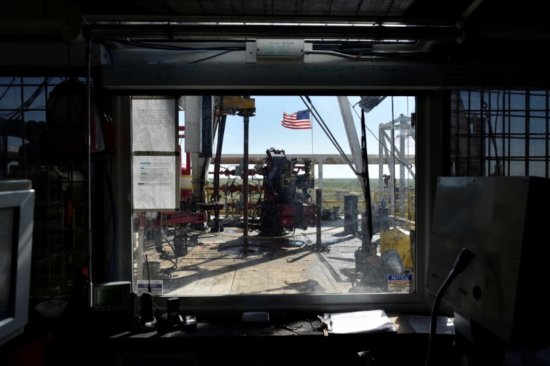 The operations floor of a drilling rig is seen from the control room on a lease owned by Oasis Petroleum in the Permian Basin near Wink