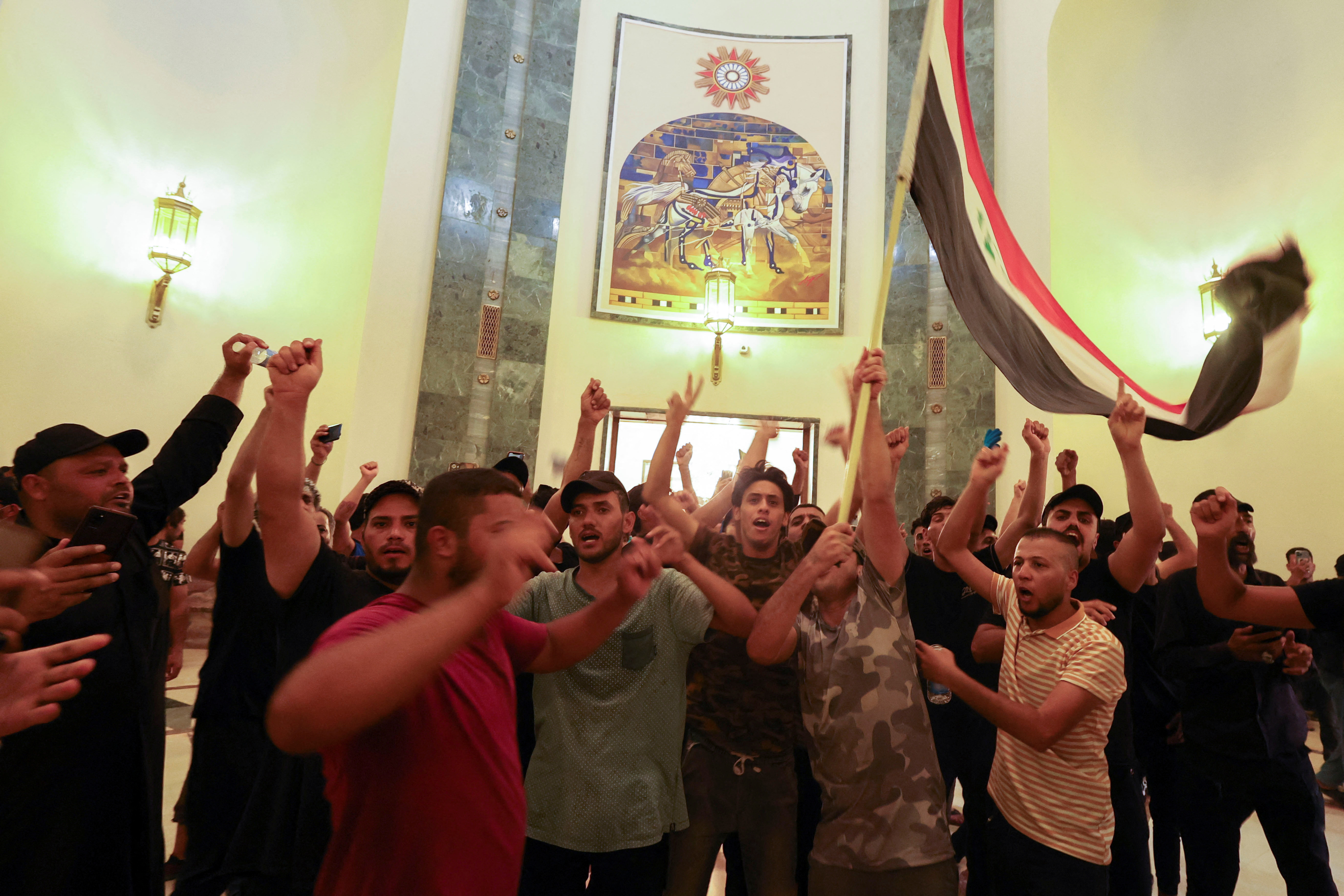 Supporters of Iraqi populist leader Moqtada al-Sadr protest inside the Green Zone, in Baghdad