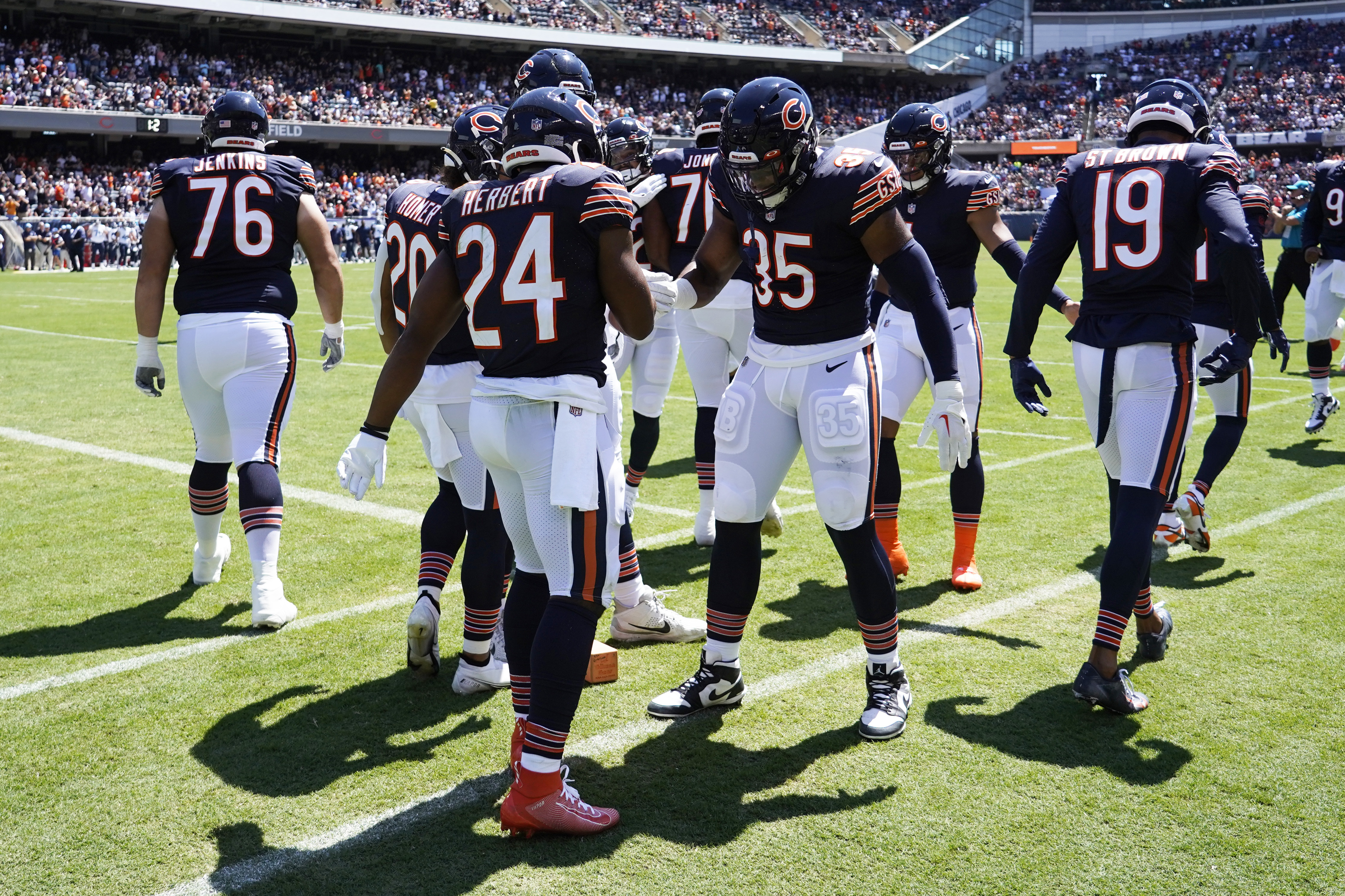 Chicago Bears defensive back Tre Roberson, left, scores a touchdown after  intercepting a pass against the Tennessee Titans in the first half of a  preseason NFL football game Saturday, Aug. 28, 2021