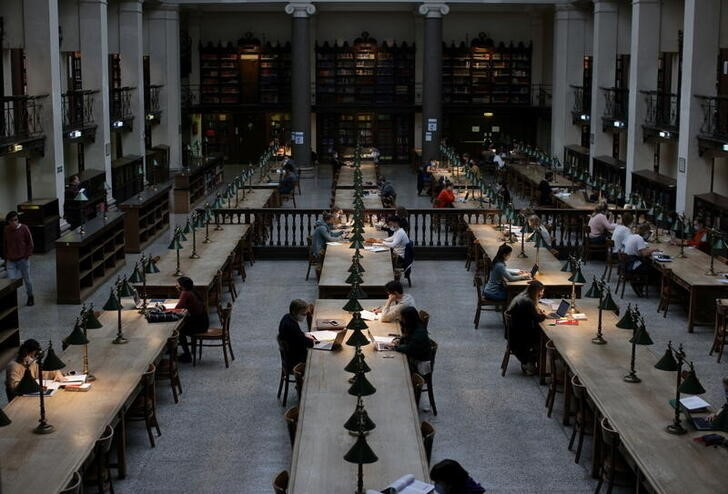 Students wearing face masks keep social distance as they study at the large reading room of Vienna University Library amid the coronavirus disease (COVID-19) outbreak, in Vienna