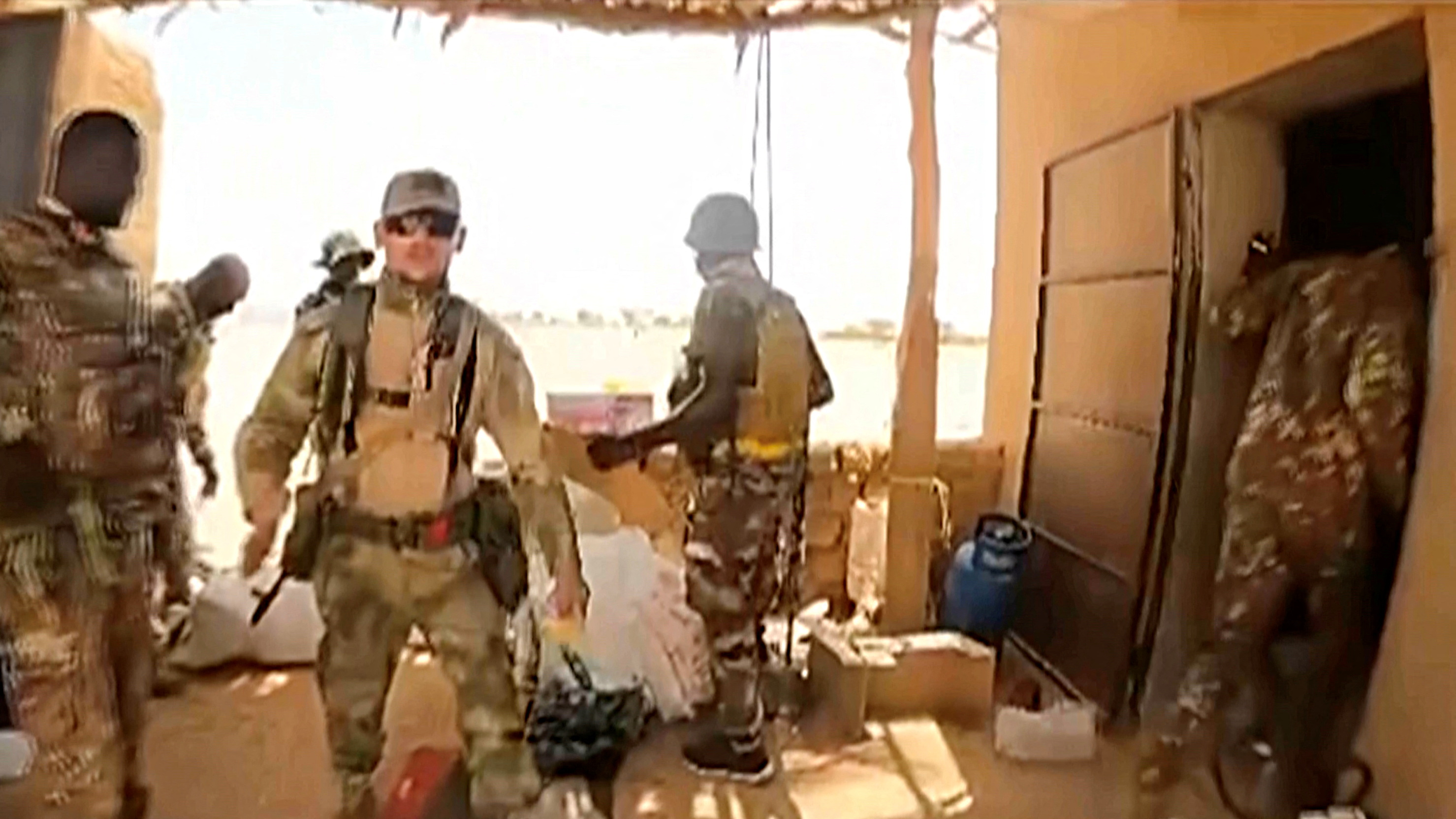 A screen grab from a handout video shows people who Tuareg rebels say are Russian Wagner mercenaries with Mali soldiers in northeastern Mali, near Aguelhok, Mali, July 2024. via Coordination of Azawad Movements 