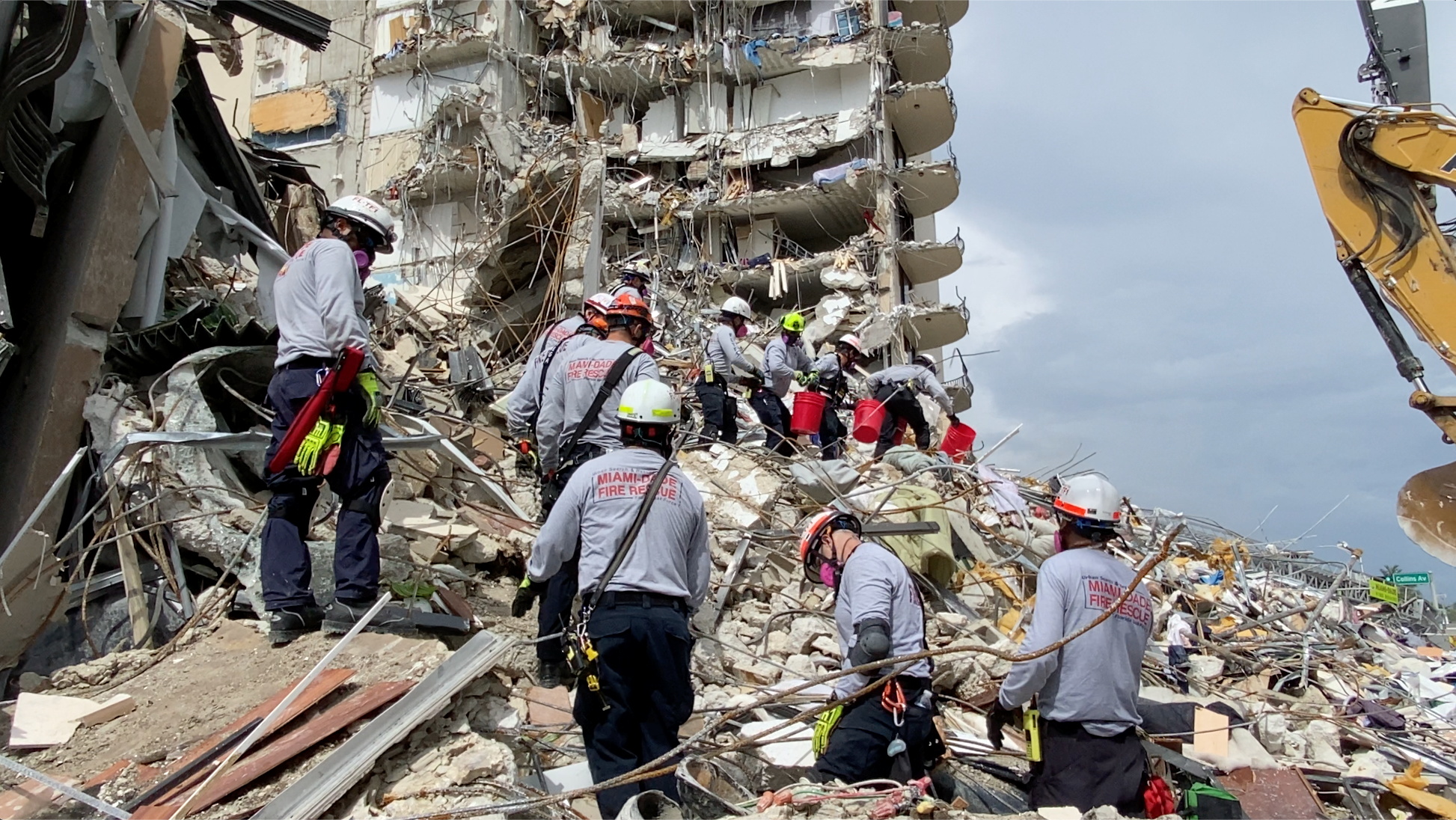 Resuce crew respond at the site after a partial building collapse in Surfside near Miami Beach, Florida, U.S., June 25, 2021, in this still image obtained from video. Courtesy of Miami-Dade Fire Rescue / Florida Task Force One / via REUTERS