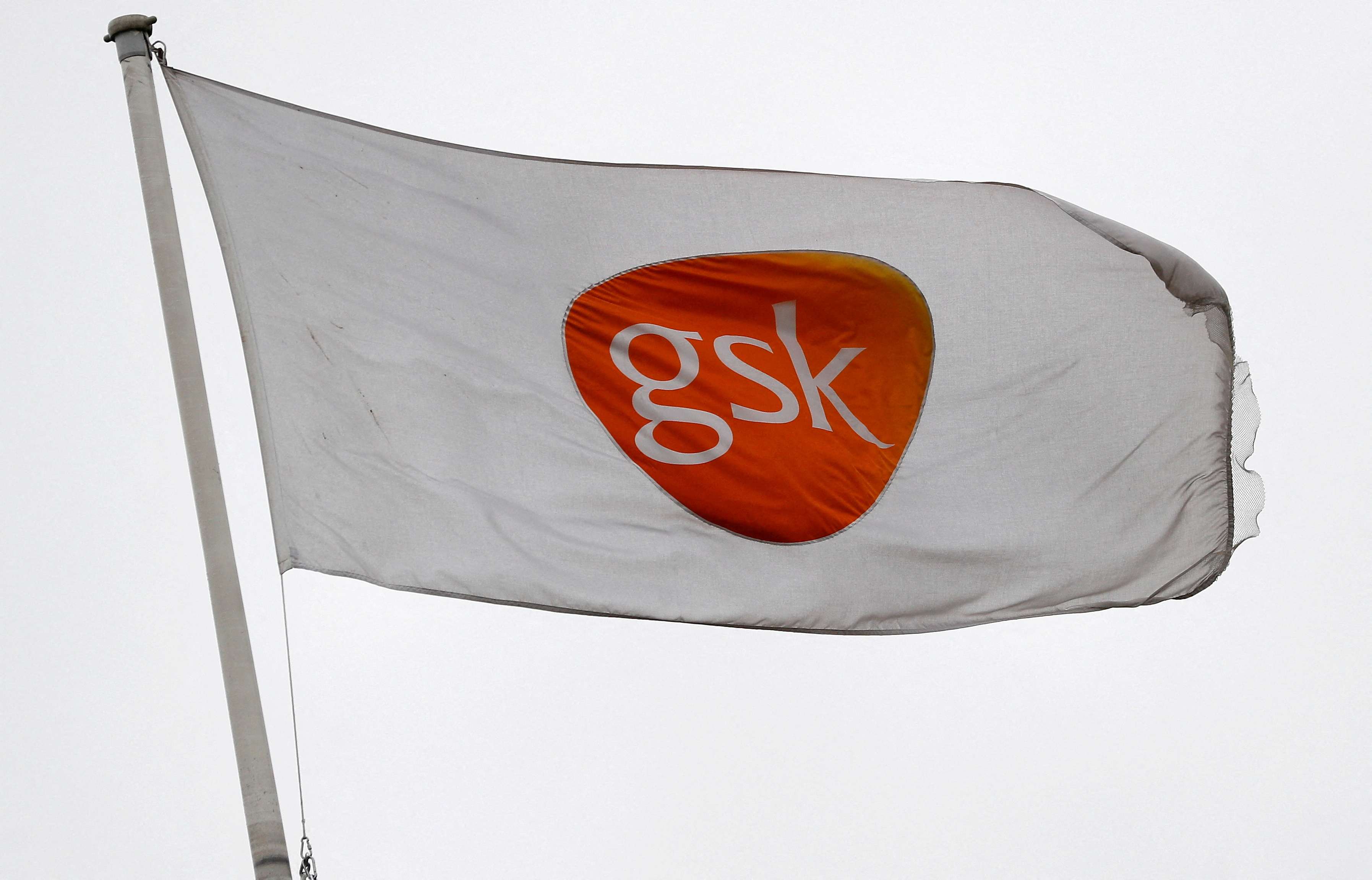 A GSK logo is seen on a flag at a GSK research centre in Stevenage
