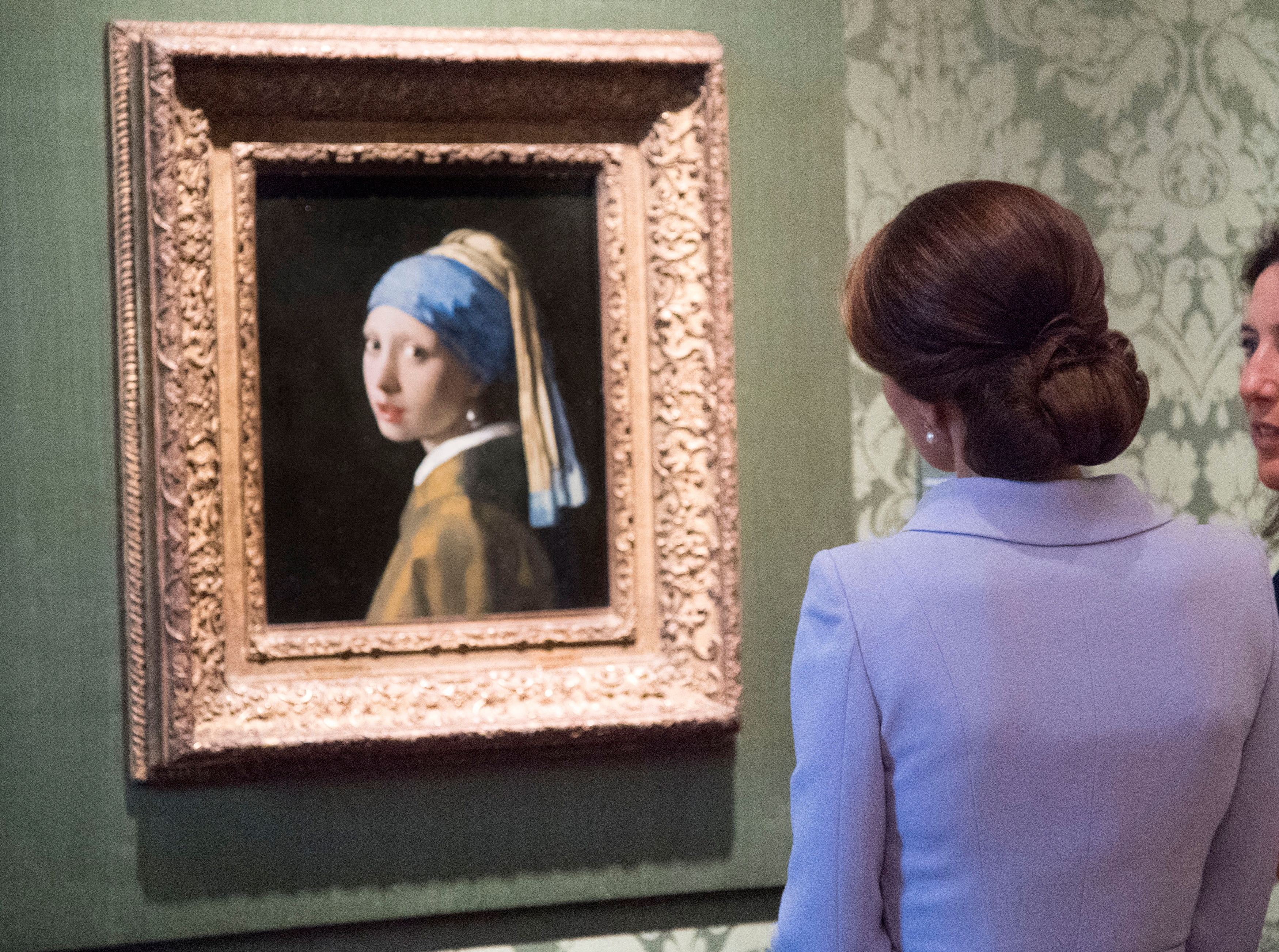 Britain's Kate, the Duchess of Cambridge views Girl with a Pearl Earring by Johannes Vermeer during a visit to the Mauritshuis in The Hague