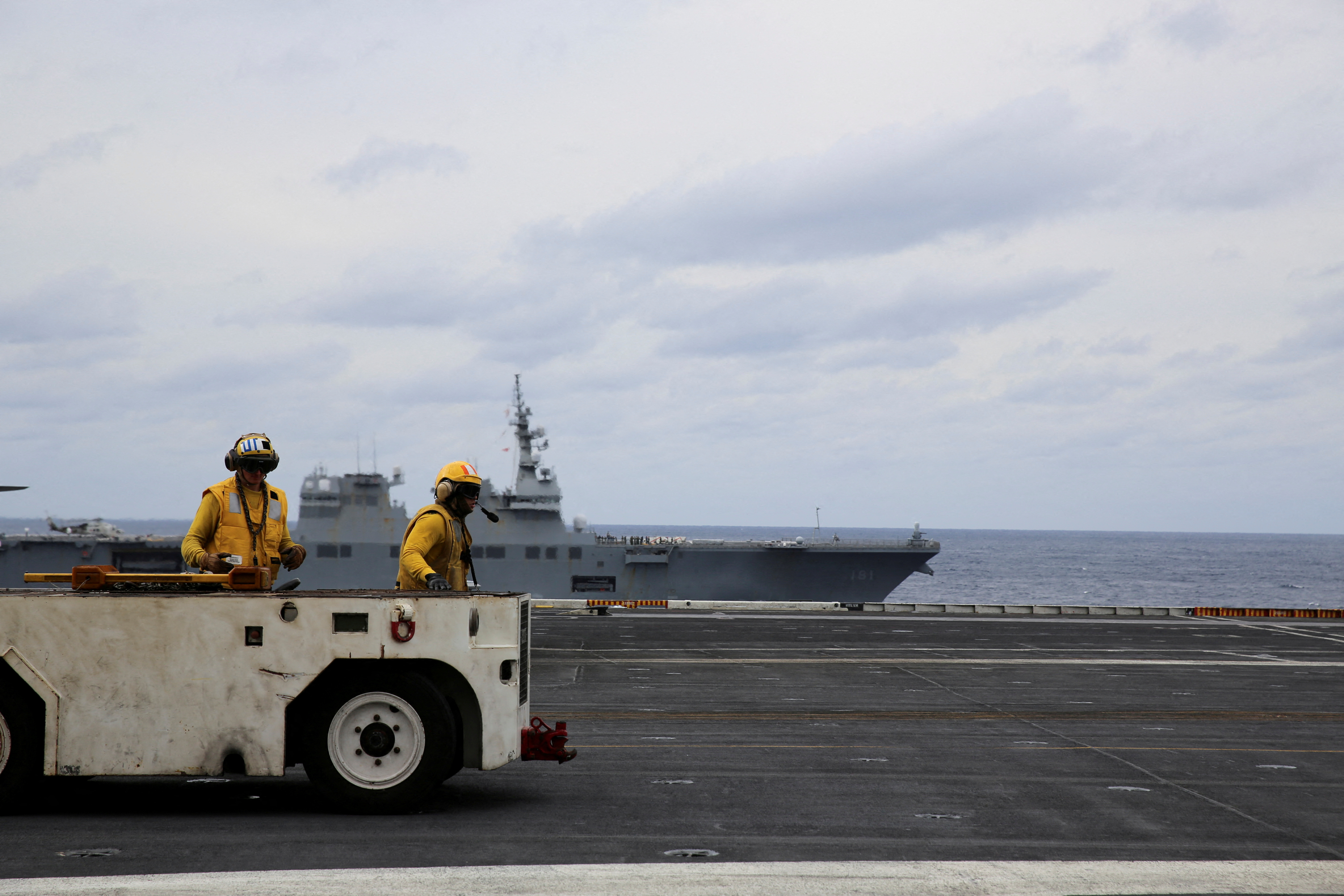 United States Seventh Fleet conducts joint exercises aboard USS Carl Vinson flanked by Japan's helicopter carrier Hyuga, in the Pacific Ocean