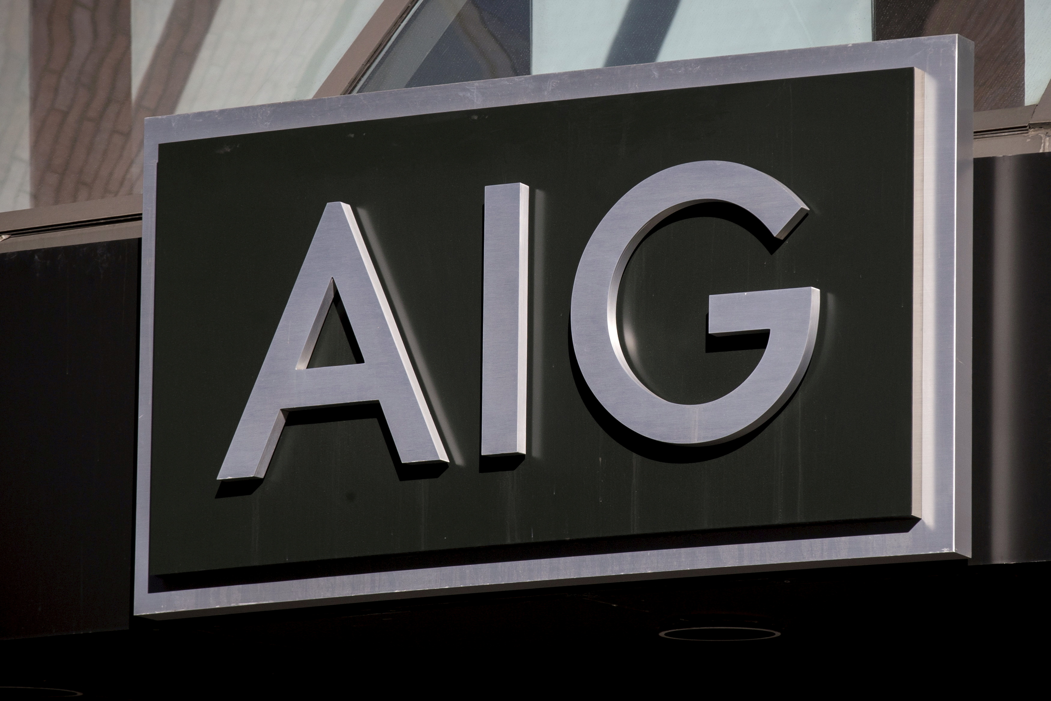 The AIG logo is seen at its building in New York's financial district March 19, 2015. REUTERS/Brendan McDermid//File Photo