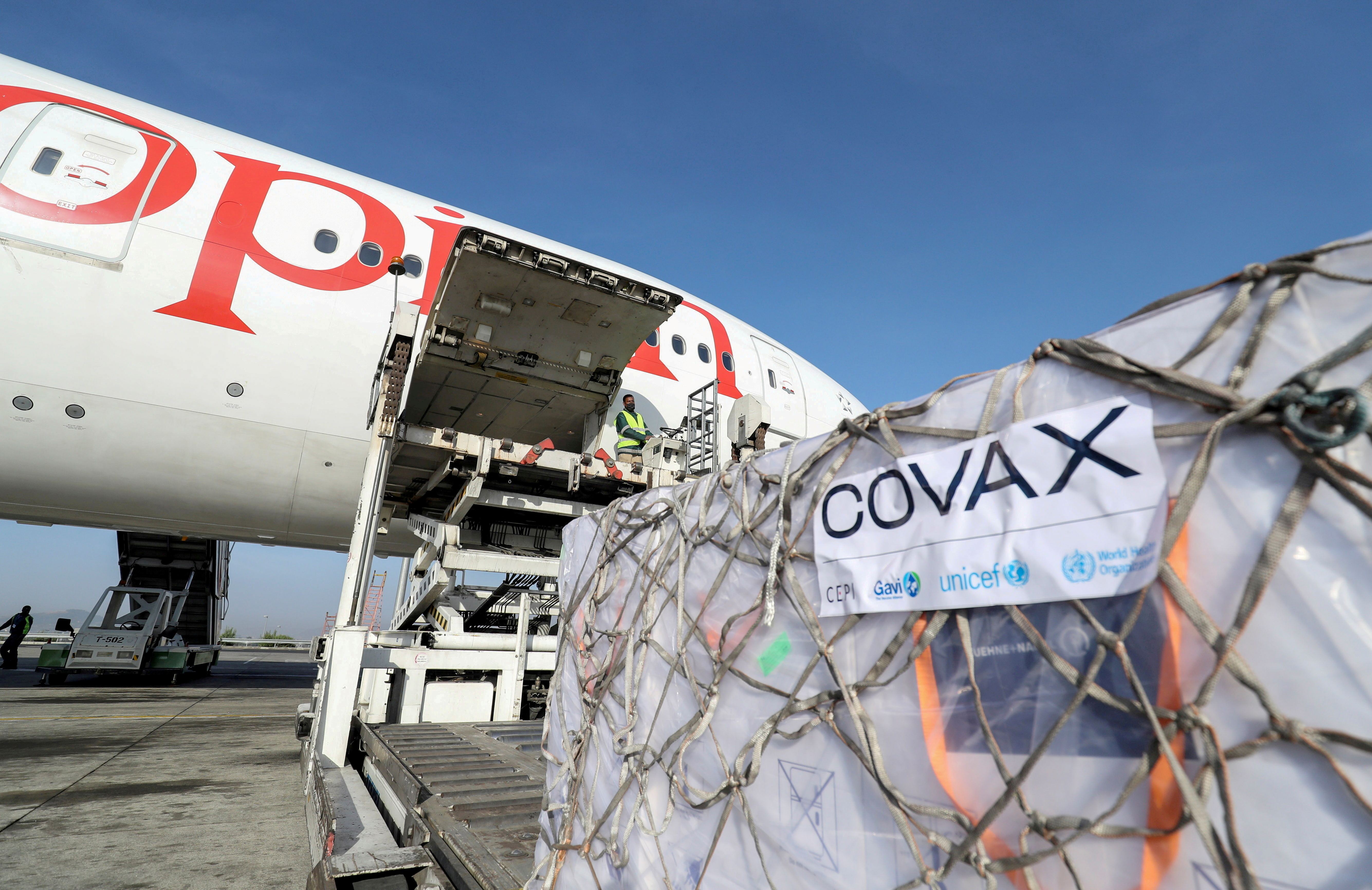 AstraZeneca coronavirus vaccines from the COVAX vaccine-sharing scheme are unloaded from a cargo plane at Bole International Airport in Ethiopia